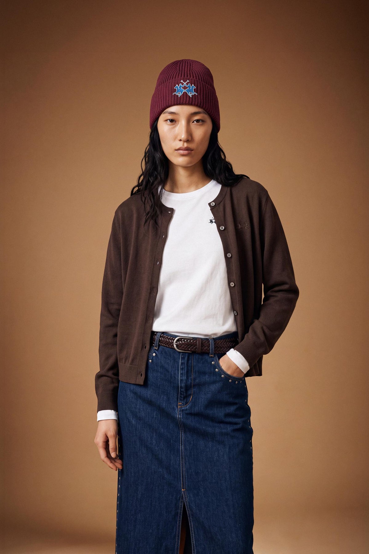 Soft lambswool blend cardigan with a smooth knit, regular fit, cropped length, ribbed crew neck, cuffs, hem, and subtle front button closure for a refined look. - Hot Fudge