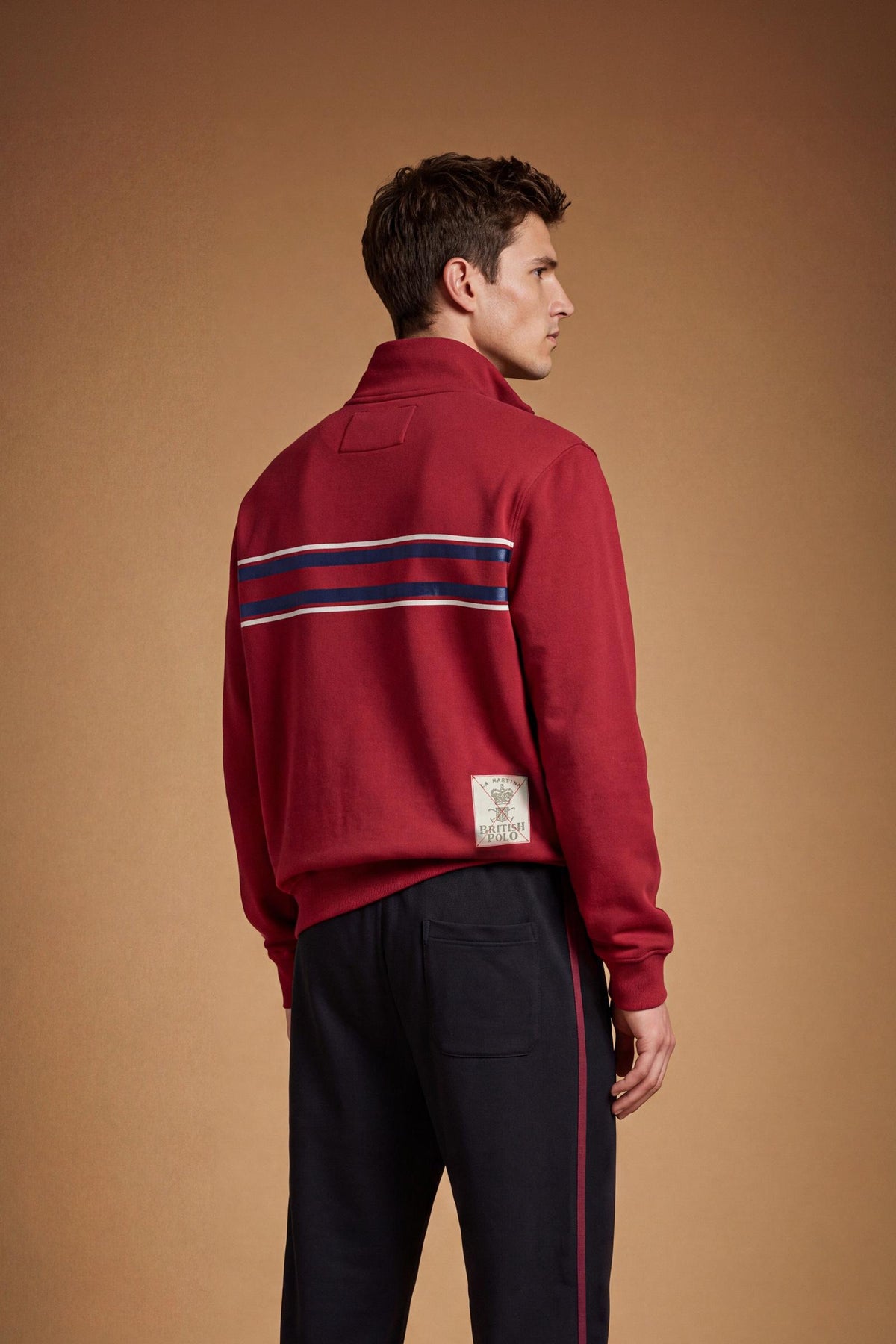 Men's long-sleeve sweatshirt in soft cotton with high double-layer collar, front zipper, ribbed cuffs, kangaroo pockets, and striking red, black, white stripes. - Red Dahlia