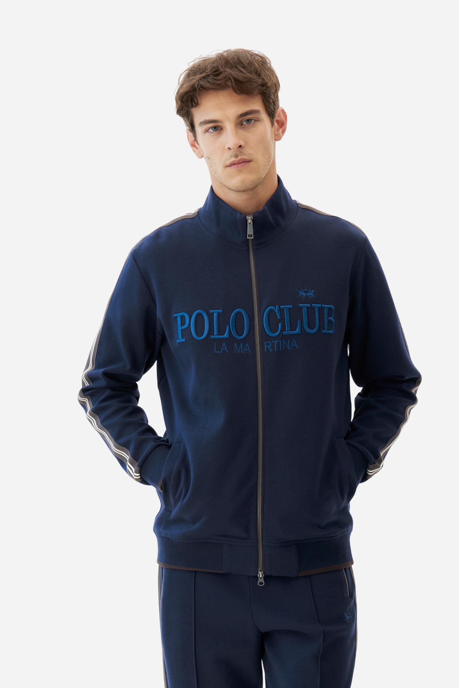 Men's long-sleeved, full-zip sweatshirt. Made of soft solid colour cotton fleece. The neck and cuffs and waistband are in solid colour ribbed knit with contrasting edging. Front zip opening and Polo club guarantee label applied to the edge inside the collar. The front lettering is a large tone-on-tone raised embroidery. A narrow two-tone striped band is applied to the shoulders and sleeves. Regular fit. The model is wearing a size L. - Navy