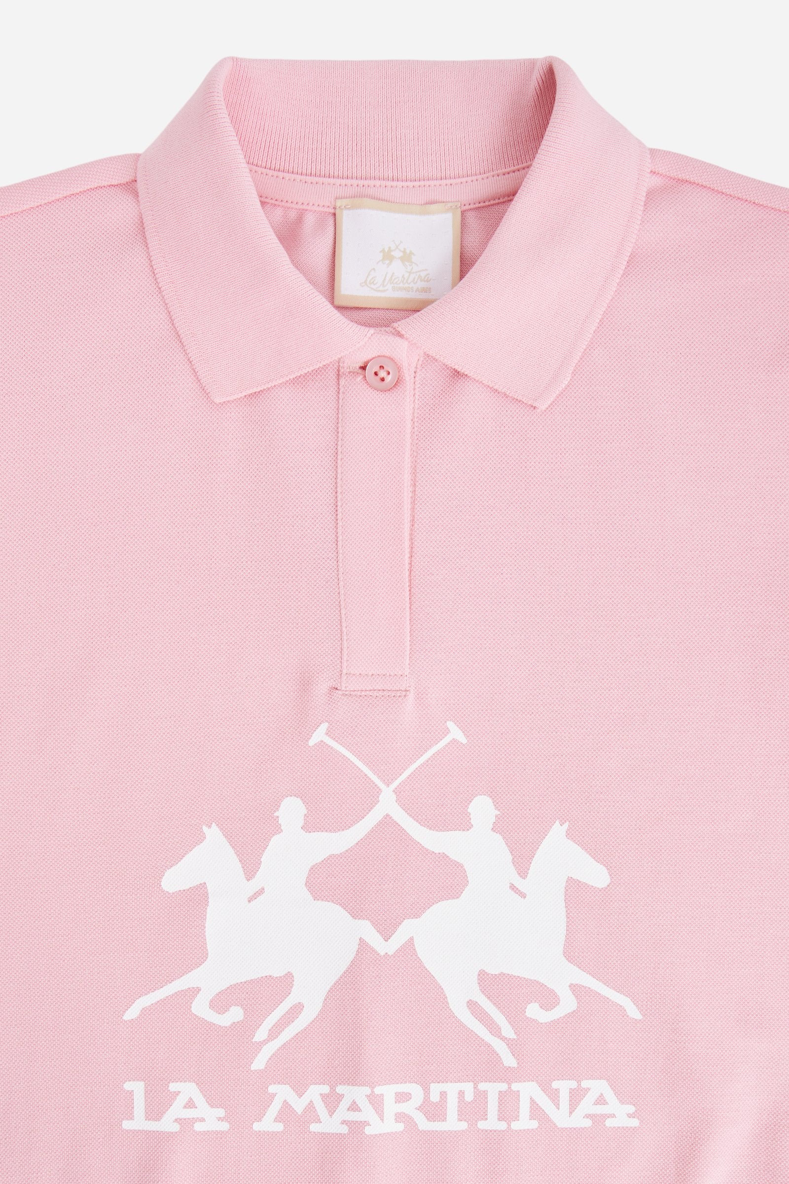 Short-sleeved polo shirt for girls made from soft 100% cotton piqué in a solid colour. The style features a regular fit, hip length and shirt collar in the same fabric with a buttonless V-neck. The contrast maxi front print, featuring the brand logo, gives the garment strong visual impact and a sporty, feminine style. - FairTale