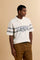 Short-sleeve polo in heavy cotton jersey with a compact structure and substantial hand feel. Contemporary fit with relaxed volume and slightly dropped shoulders. Classic collar with visible placket and bold horizontal band with geometric multicolor tapes. Raised “La Martina” embroidery on the chest and contrasting 3D logo on the back. - Off White                                                                                                                                                                    