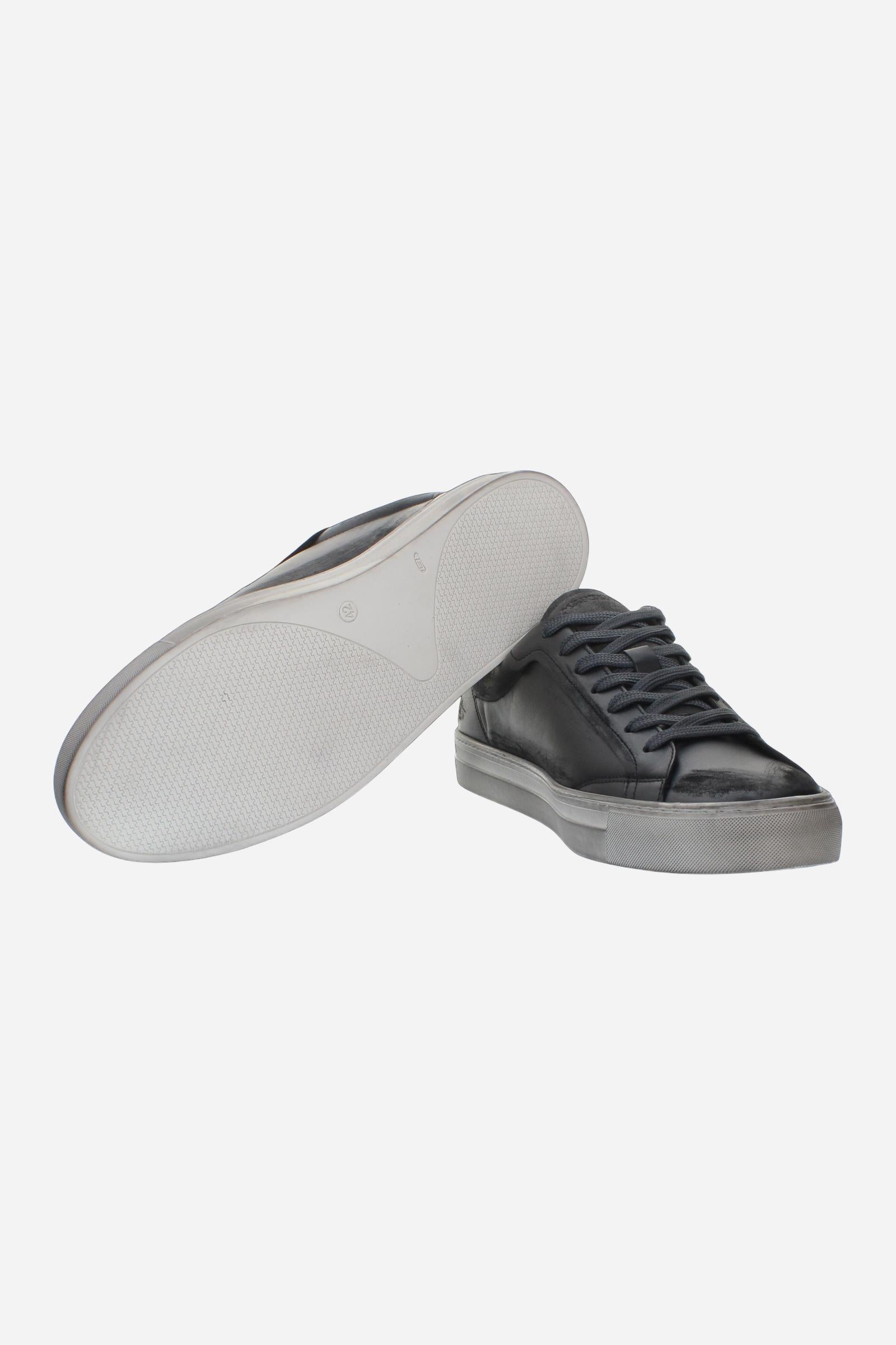 Leather sneaker blending vintage and modern style, with flexible divided tongue, nubuck heel, hand-stitched details, and a lightweight, comfortable off-white sole. - Black