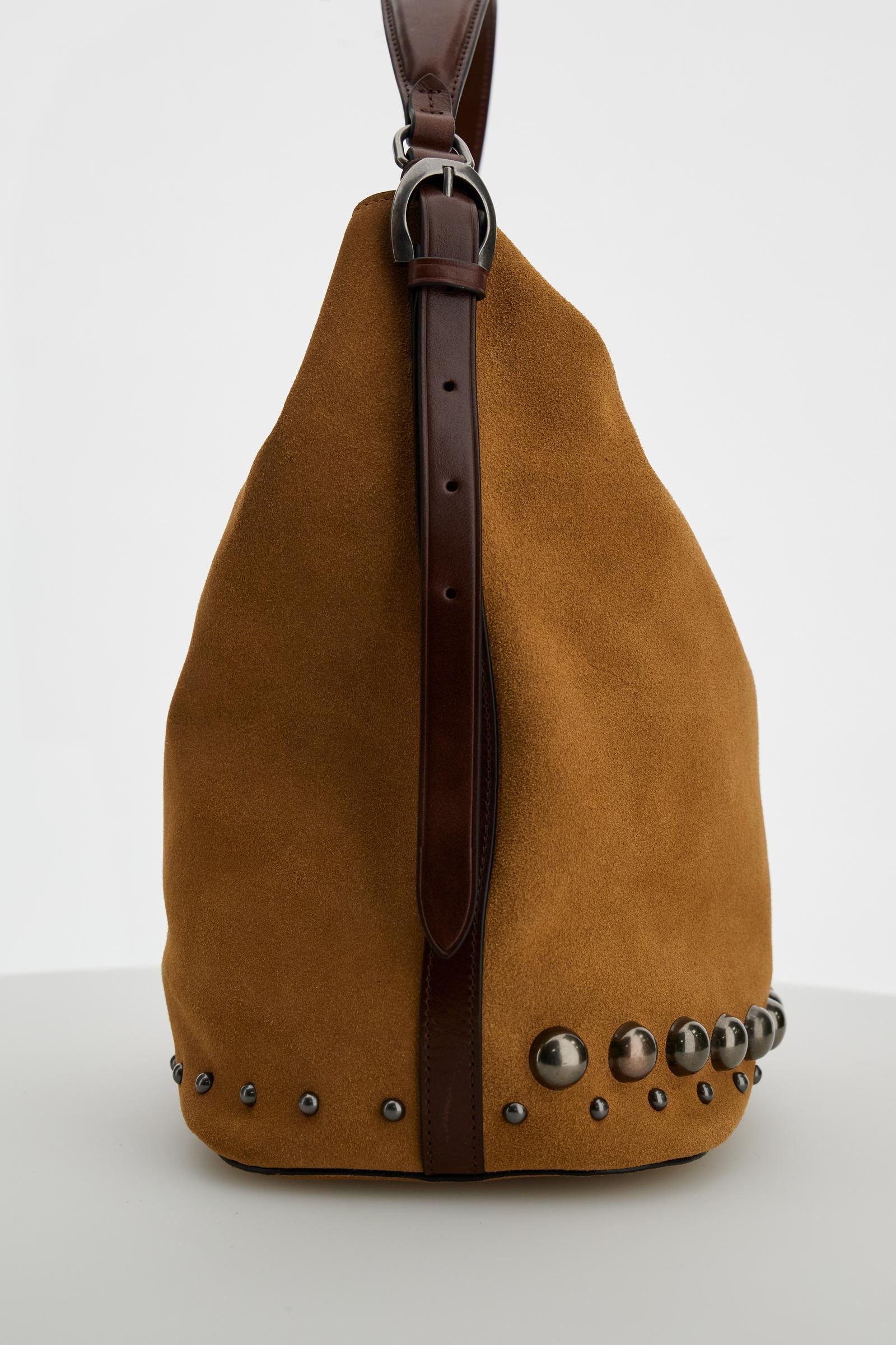 Soft suede hobo bag with leather trims, metal studs, spacious interior, zip pocket, and adjustable shoulder strap for durability and modern style. - Mou/Sienna
