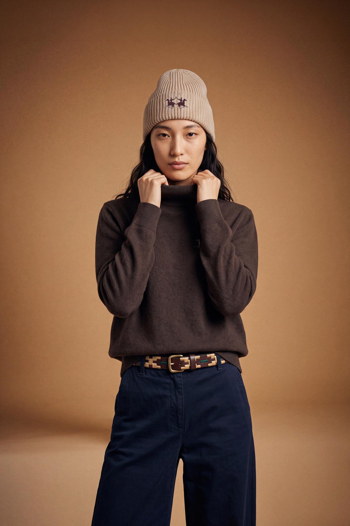 Women's lambswool turtleneck sweater with a soft, ribbed collar, fitted bust, ribbed cuffs and hem, and subtle embroidered logo for a clean, elegant look. - Hot Fudge