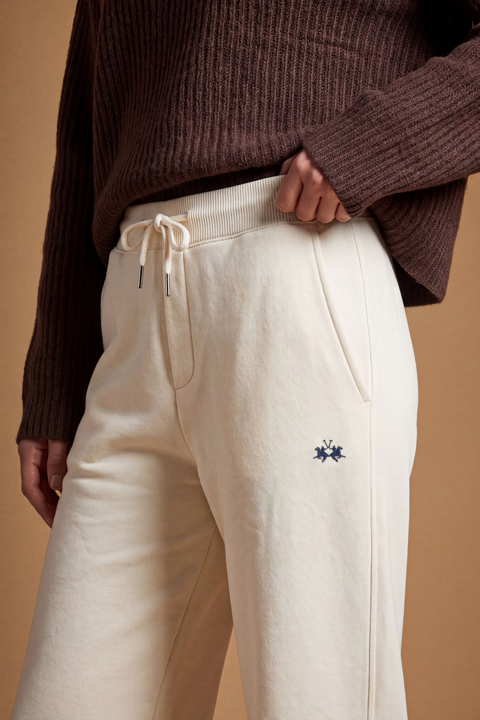 Women's pants in soft brushed cotton with an elastic waistband, adjustable drawstring, vertical side pockets, and a relaxed wide-leg fit for all-day comfort. - Pristine