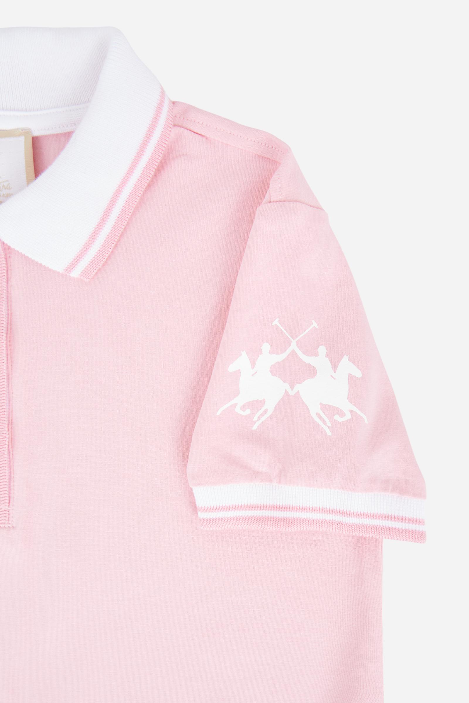 Short-sleeved polo dress for girls made from pure cotton piqué in a solid colour. The style features a comfortable fit, fluid silhouette and above-the-knee length. The two-tone ribbed collar, buttoned front opening and striped trims add a sporty and refined touch. The logo on the sleeve and the lettering under the collar complete the design. - FairTale