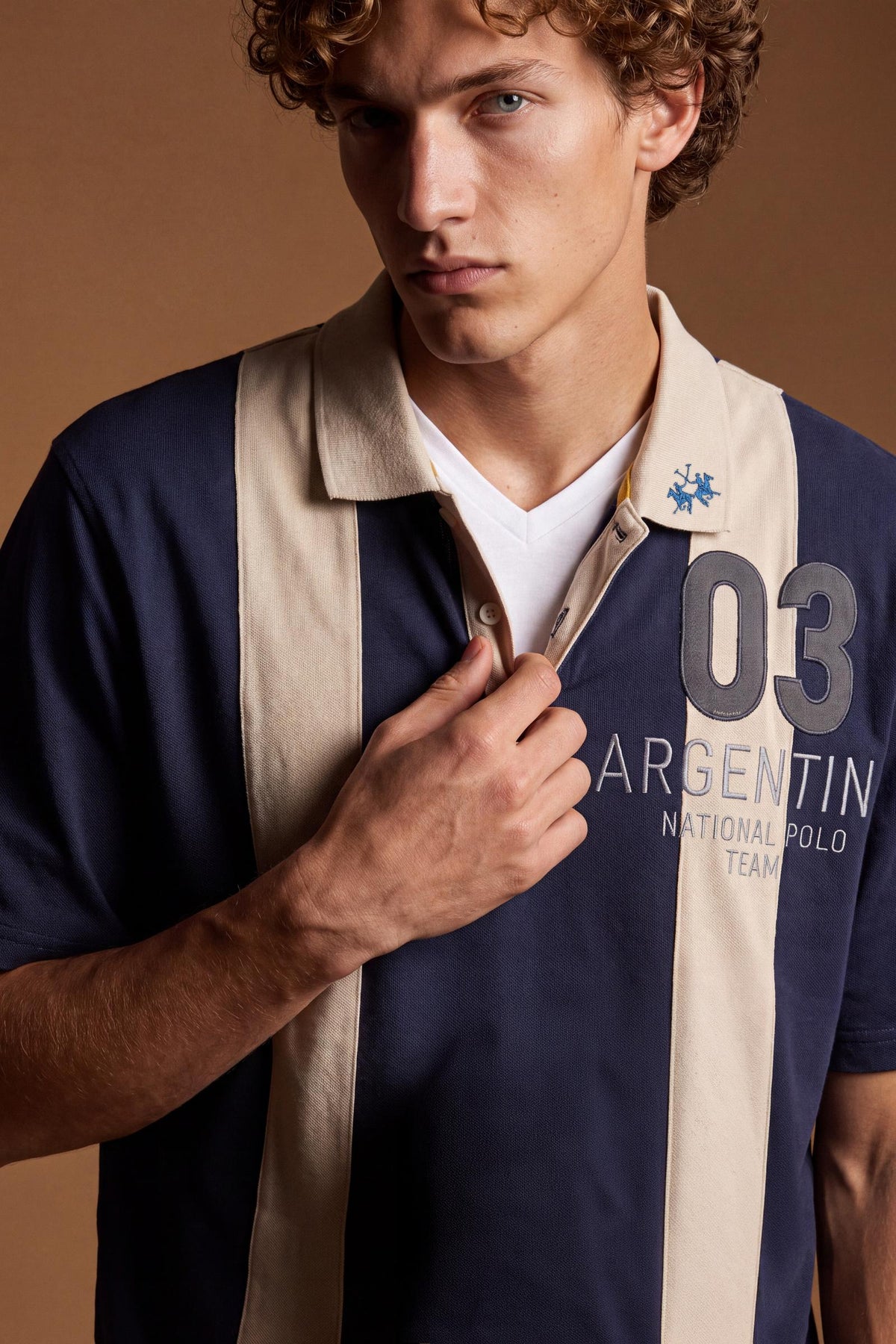 Men's short-sleeve polo in heavy 100% cotton with wide contrasting stripes, knitted collar, two-button placket, relaxed fit, and bold chest embroidery. - Navy Blazer