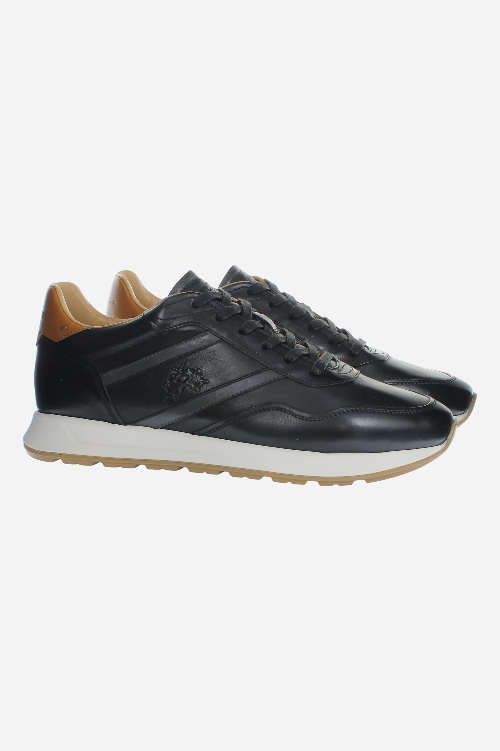 Men's sneaker combining calf and vegetable-tanned leather with artisanal stitching, branded logo, and high-cushioning rubber PU sole for lasting comfort and style. - Black