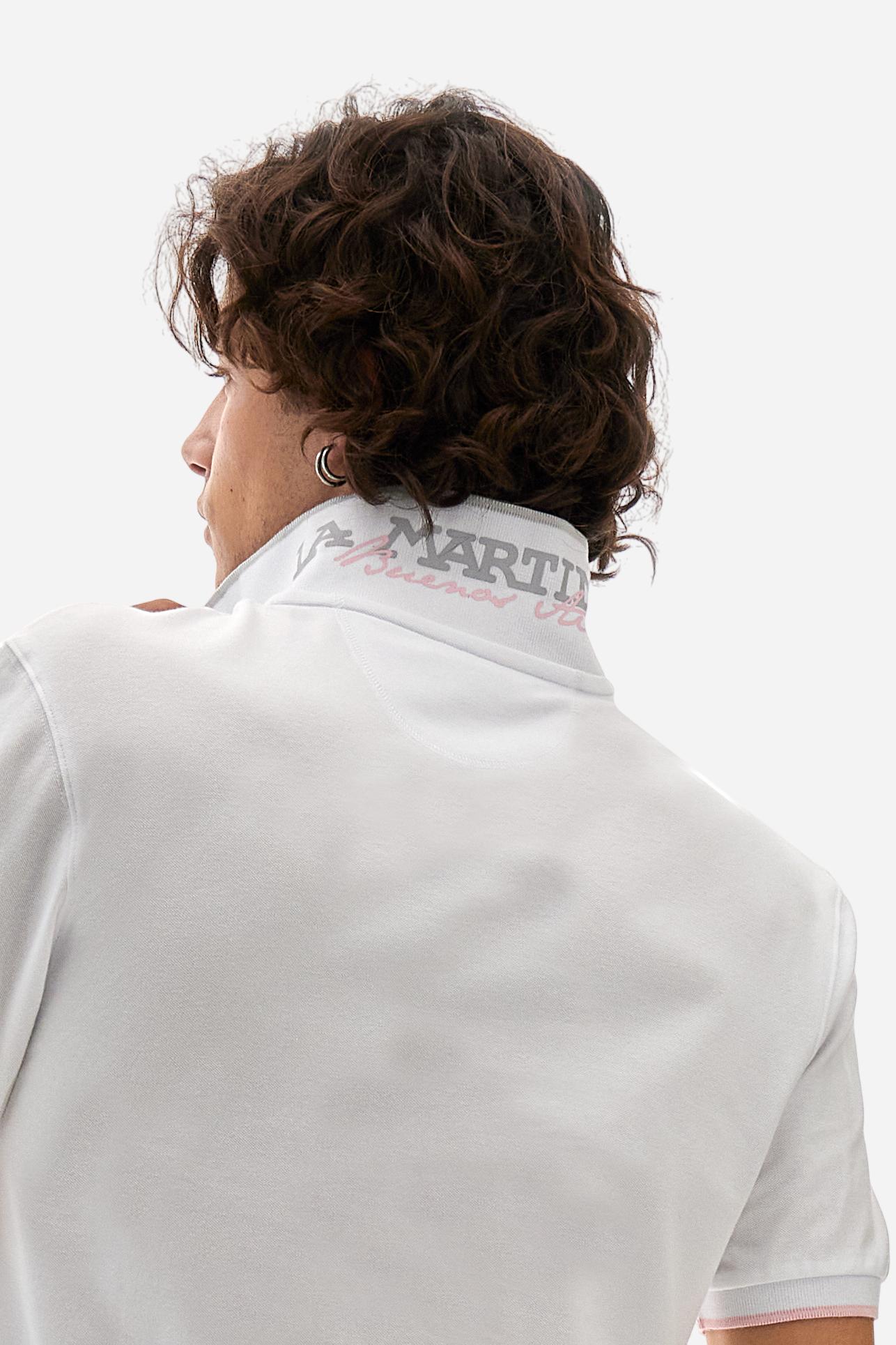 Short-sleeved, single-colour men's polo shirt made of stretch cotton piqué. Fastens with two buttons.  The collar and cuffs are ribbed, and there is a colour-contrasting trim at the bottom of the collar.  Inside the collar there is a grosgrain ribbon of a different shade. The logo is embroidered on the chest in a contrasting colour. The fit is slim. The model is wearing a size L. - Optic White