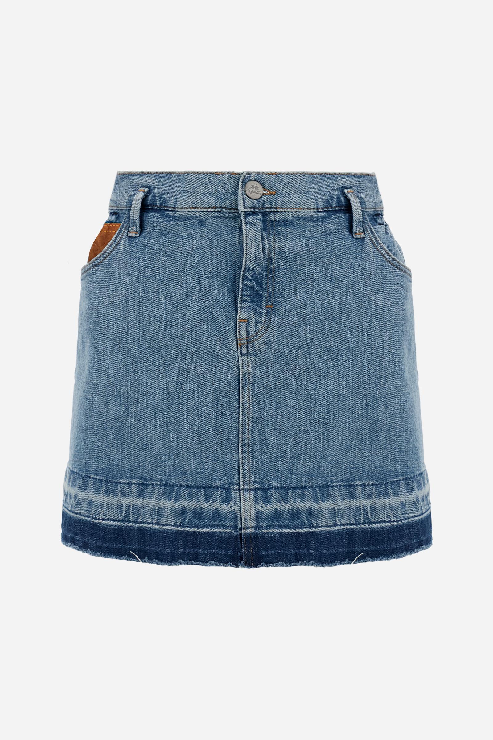 Denim mini skirt with light-medium wash and worn-in effect. Slightly flared five-pocket style with raw-cut hem and contrast pocket with logo. - Medium Indigo Denim