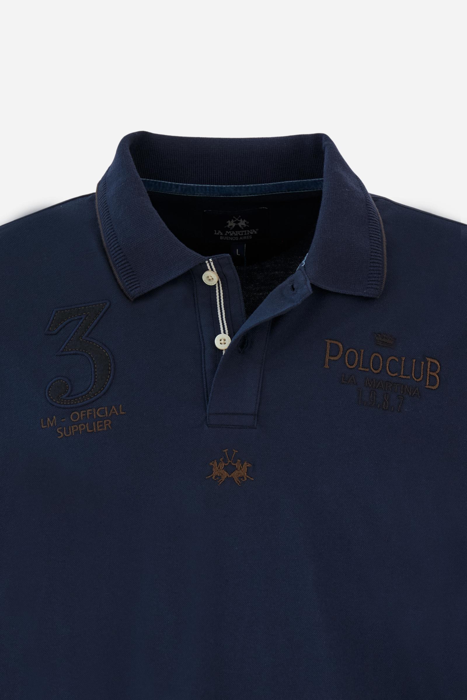 Men’s long-sleeve polo in stretch piqué, solid color. Ribbed collar and cuffs with striped details for a refined touch. Contrast fabric insert under the collar. Chest patch with number 3 and embroidered lettering celebrating the Polo Club. Small brand logo embroidered in contrast under the front placket. Regular fit. Model wears size L. - Navy