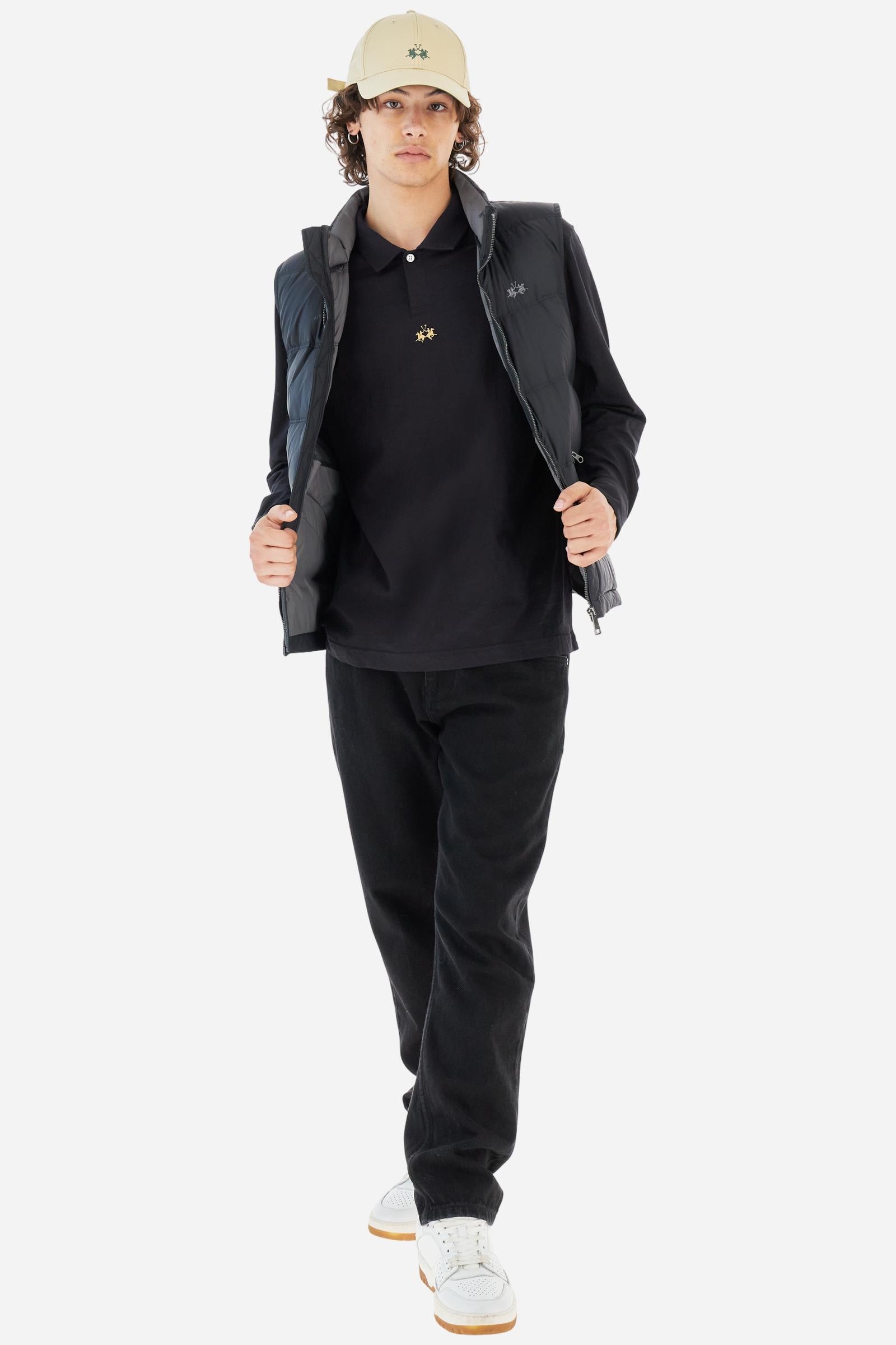 Men’s long‑sleeve polo in slub cotton jersey. Classic collar and single personalised button; long‑sleeve re‑edition of the iconic 1942 style with shirt cuffs. Small contrast logo below the placket; signature warranty‑label at back hem. Easy fit. Model wears size L. - Black