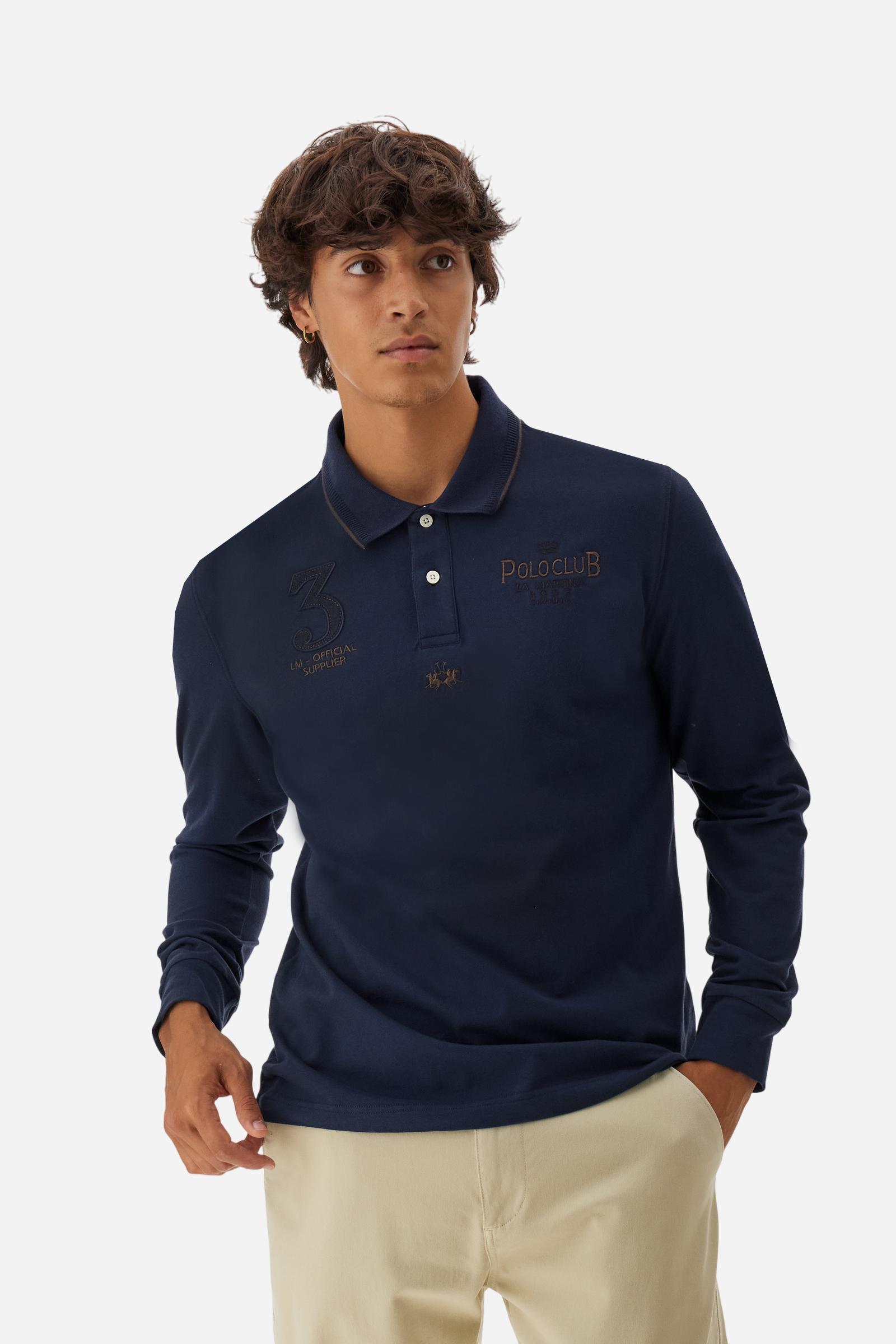 Men’s long-sleeve polo in stretch piqué, solid color. Ribbed collar and cuffs with striped details for a refined touch. Contrast fabric insert under the collar. Chest patch with number 3 and embroidered lettering celebrating the Polo Club. Small brand logo embroidered in contrast under the front placket. Regular fit. Model wears size L. - Navy