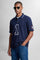Numbered style with exclusive label, produced in only 100 pieces per style/colour. The label is positioned on the back, at the lower right, with the progressive number clearly visible. Short-sleeved polo shirt made from 100% cotton jersey. The contemporary-cut design features a modern, wide and relaxed silhouette, with a distinctly current streetwear touch. The collar is ribbed with contrast stripes, while the cuffs are ribbed tone-on-tone. The contrast number “1” on the chest, made from raw-edge finished f