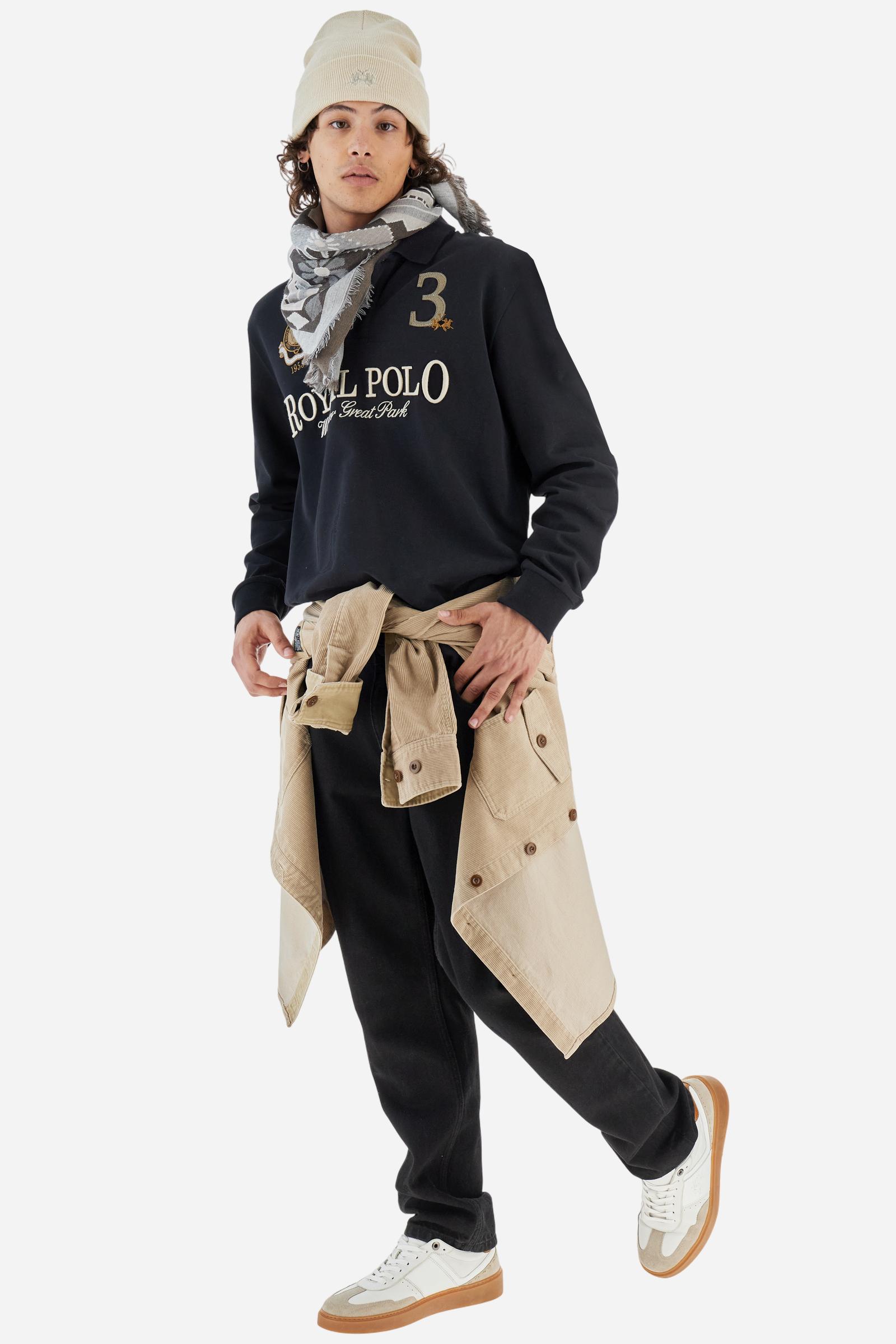 Men's long-sleeved solid colour, cotton jersey polo shirt. Two-button opening with contrasting details. Solid colour ribbed collar and cuffs. The chest features embroidered crests and lettering inspired by British royal heritage. The number 3 features on a patch with a fringed edge. The small brand logo is embroidered next to the number in contrasting colour. Regular fit. The model is wearing a size L. - Black