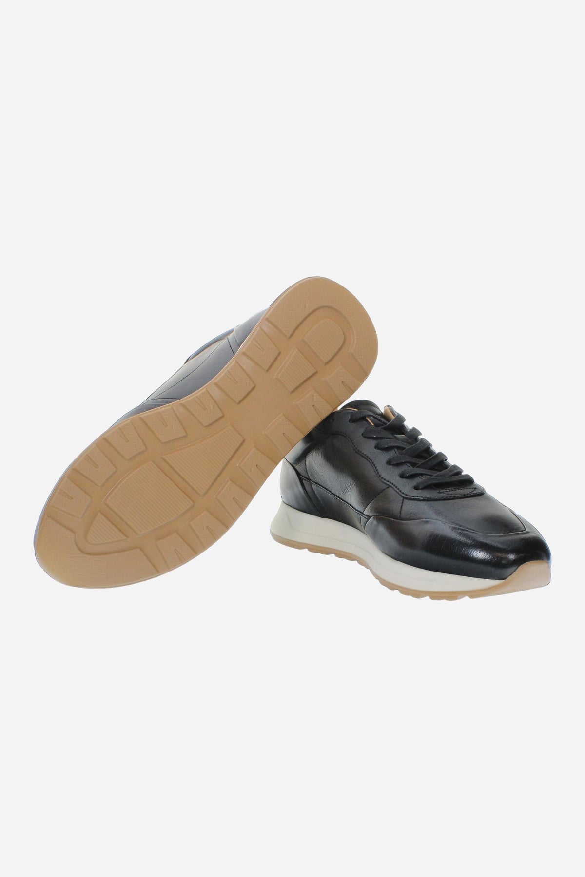 Men's sneaker crafted from soft vegetable-tanned leather with handcrafted stitching, embossed logo, two-tone rubber PU sole, and leather-colored lining. Made in Italy. - Black