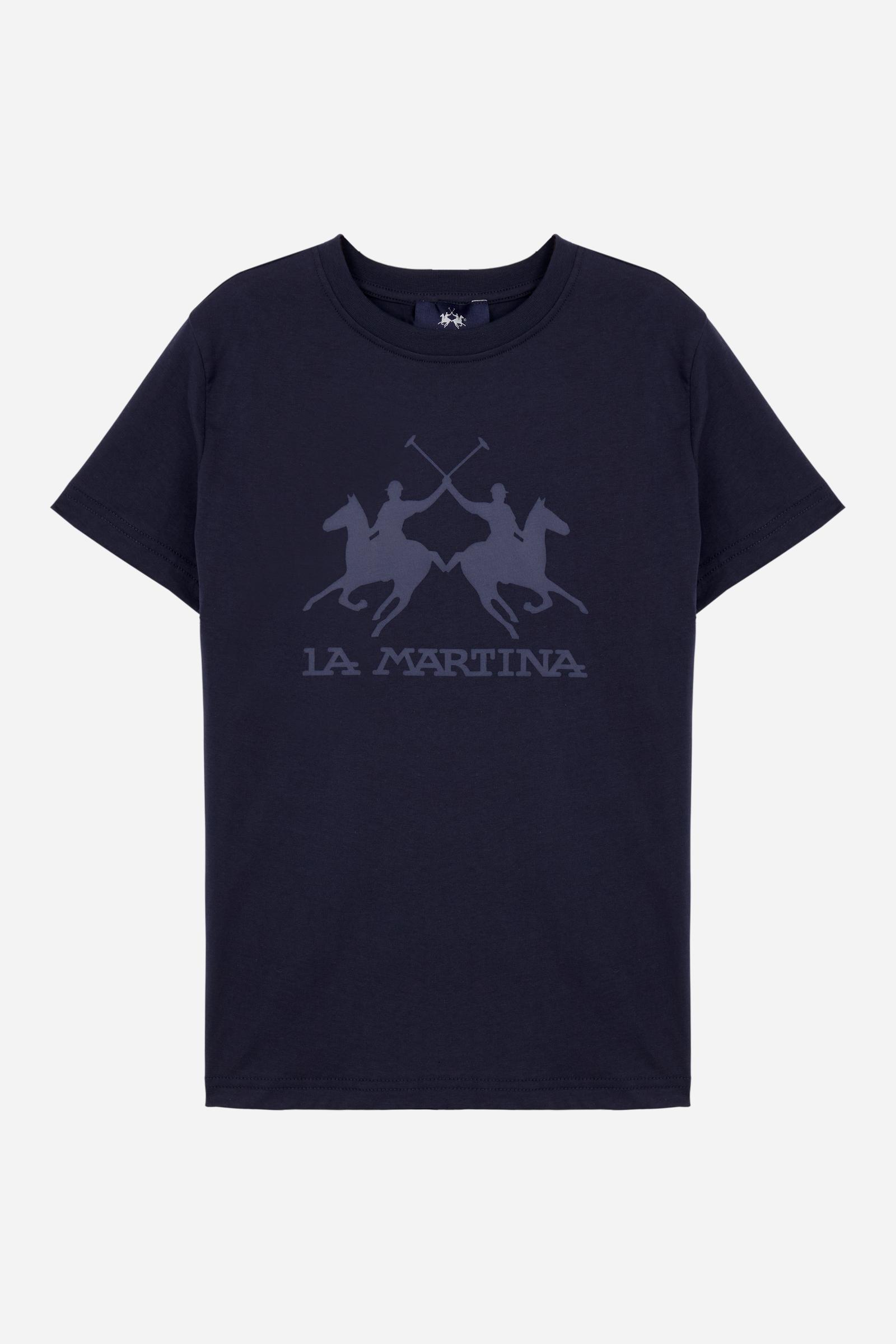 Short-sleeved T-shirt for boys made from soft 100% cotton jersey in a solid colour. The style features a regular fit and tonal ribbed crew neck. The maxi front print, featuring the iconic crossed polo players logo and La Martina lettering, gives the garment strong visual impact and a bold sporty style. - Navy
