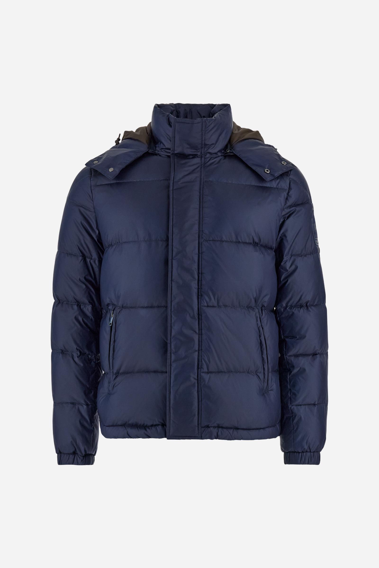 Men’s padded bomber jacket with detachable hood. Made of solid iridescent nylon with contrast lining. Equipped with two practical inner braces for extra comfort. Double customized zip front closure with inner placket featuring contrast Polo Player print, closed with metal snap buttons. Two vertical zipped pockets on the front. Hood with contrast lining and adjustable elastic drawstring. Bold Polo Player graphics printed inside. Regular fit for comfortable movement without bulk. Model wears size L. - Navy