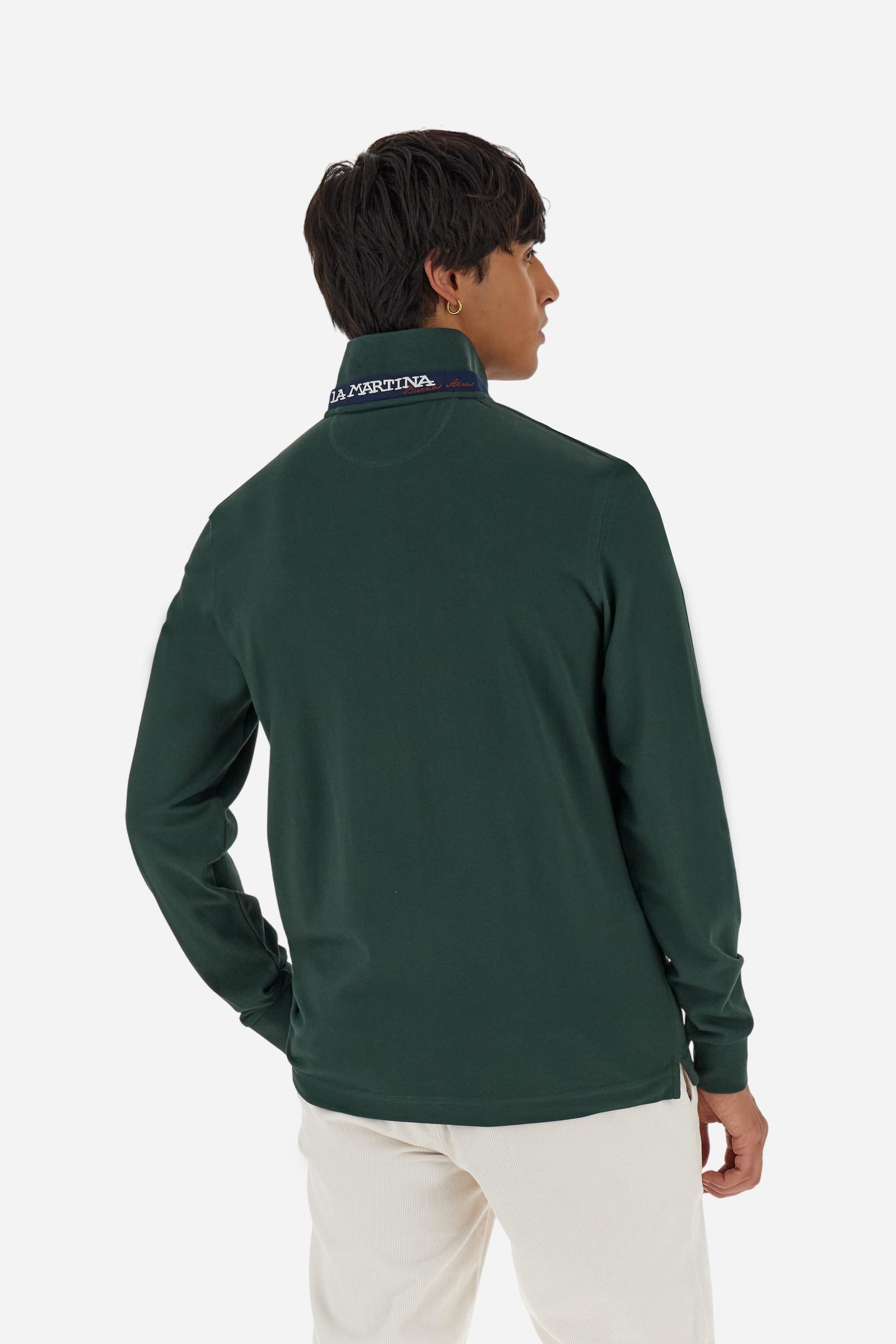 Men’s long-sleeve polo in high-quality stretch cotton piqué for comfort and flexibility. Tone-on-tone ribbed collar with contrast gabardine undercollar embroidered with the brand’s iconic lettering, revealed when the collar is lifted. Contrast embroidered logo on the chest. Slim fit, offering a modern silhouette that enhances the body while ensuring freedom of movement. Model wears size L. - Sycamore