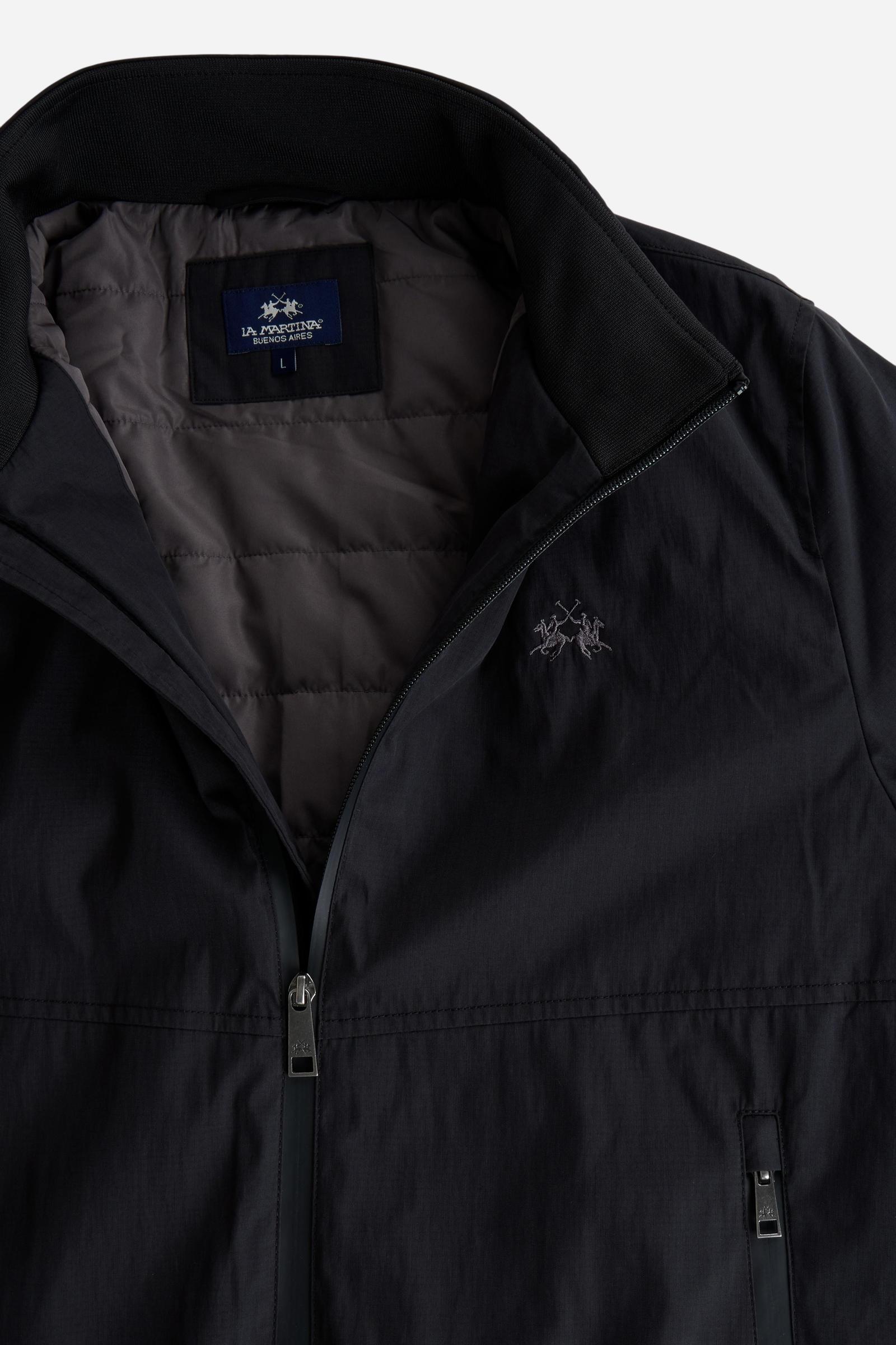Men's padded jacket in cotton-polyamide blend for comfort and durability. Features high collar, zip closures, elastic ribbed trims, and polyester quilted lining - Black