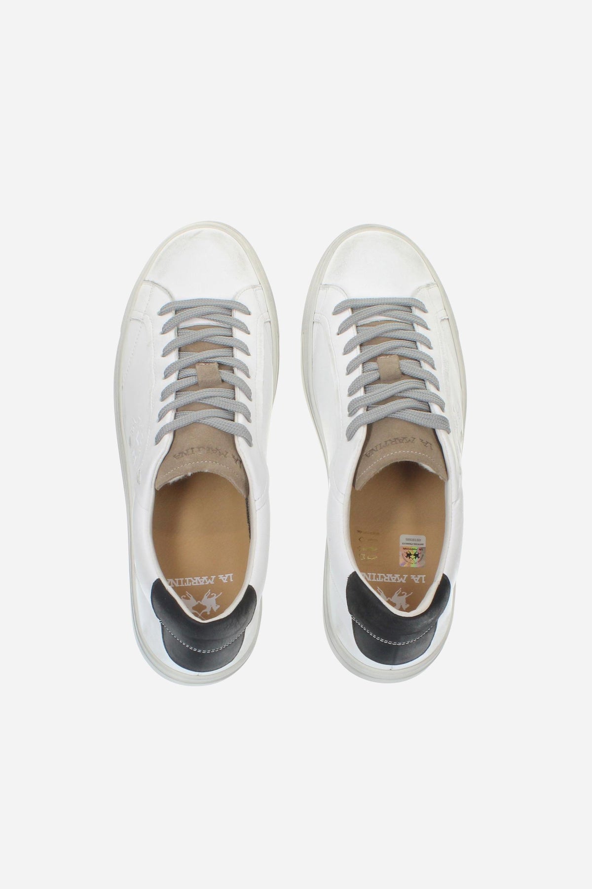 Leather sneaker blending vintage and modern style, with flexible divided tongue, nubuck heel, hand-stitched details, and a lightweight, comfortable off-white sole. - Optic White