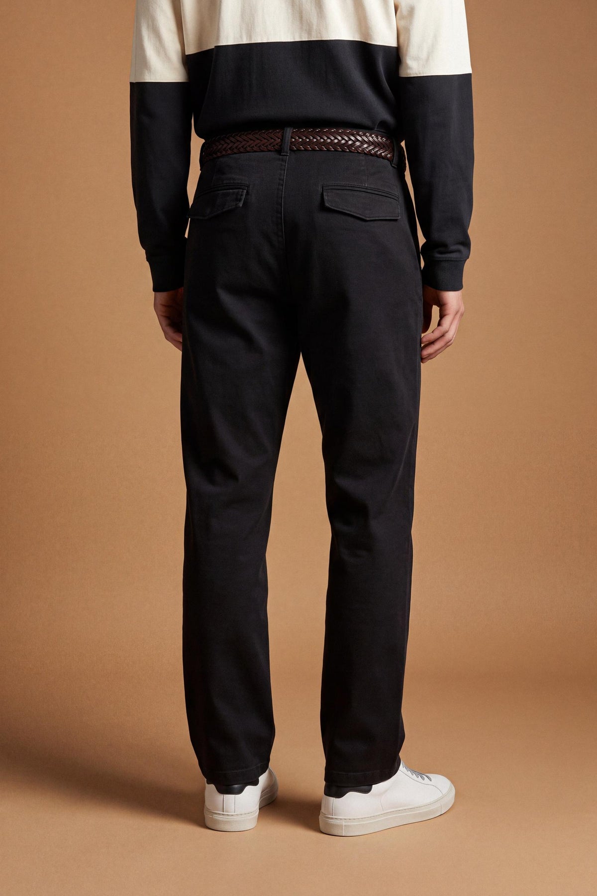 Men's stretch cotton twill trousers with a regular fit, straight leg, American-style side pockets, flap back pockets, and a waistband with zip, button, and belt loops. - Black