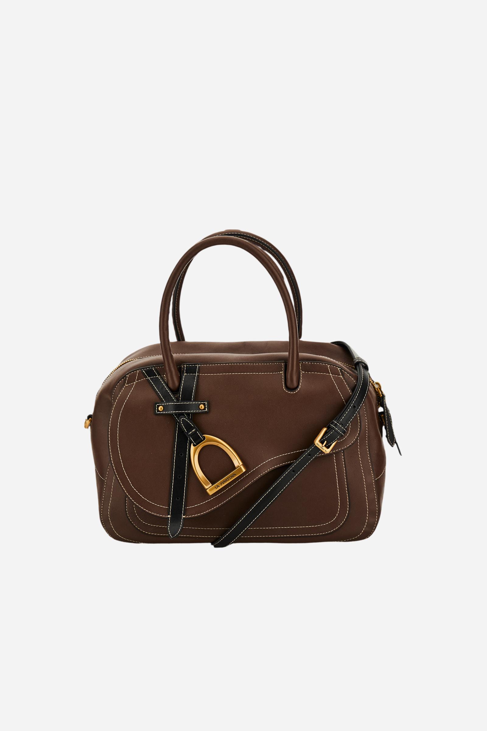 Elegant women's tote in full-grain leather with semi-rigid structure, gold-tone stirrup detail, double handles, adjustable strap, and roomy, secure interior. - Sienna/Black