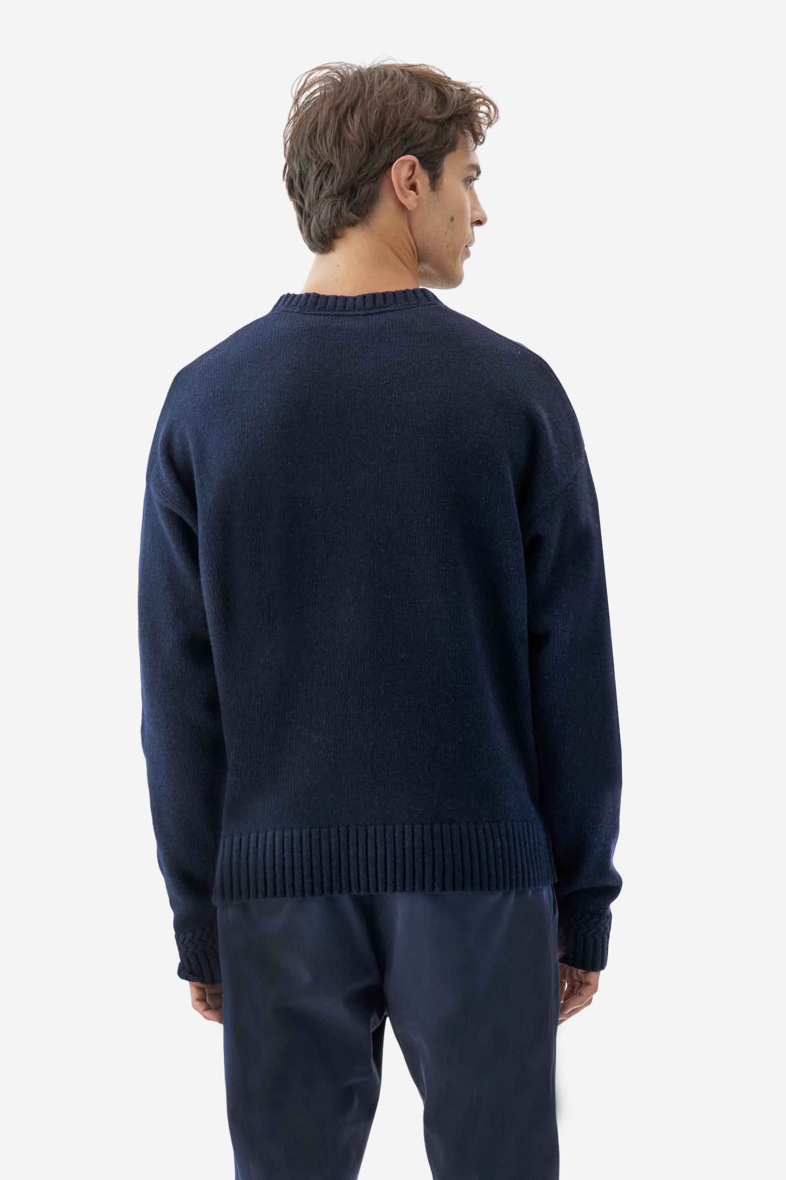 Men’s crew-neck sweater with long sleeves in high-quality wool blend. Ribbed collar, cuffs and hem with zigzag detail at sleeve attachment. Argyle motif on the front and contrast embroidered logo on the cuff. Regular fit with dropped shoulders for a contemporary look. The model wears size L. - Navy