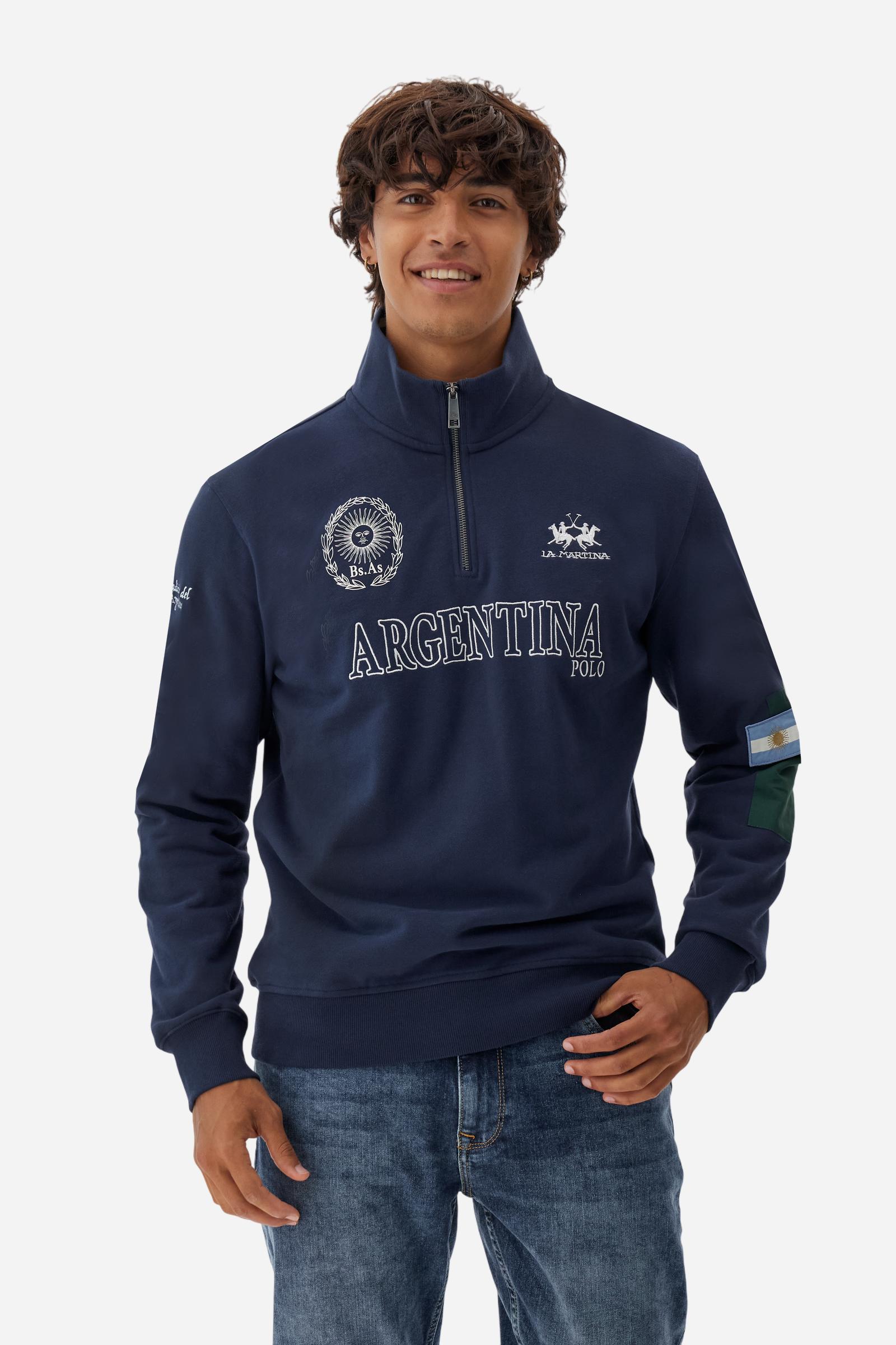 Men's long-sleeved solid colour sweatshirt in cotton. Made of pure cotton fabric with a soft, velvety touch. Practical half-zip opening and ribbed cuffs and collar details. Vivid multi-coloured with Argentina-inspired graphics on the chest and sleeves. The logo is embroidered on the left side of chest for a subtle touch of branding. The fit is regular to suit everyday wear. The model is wearing a size L. - Navy