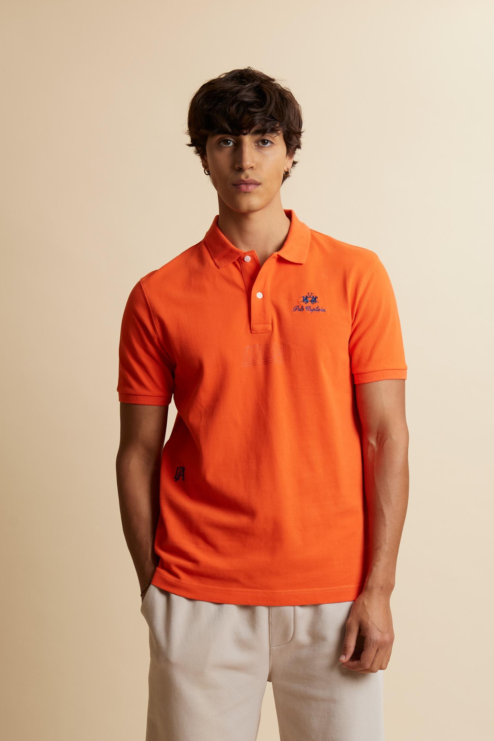 Men’s short-sleeve polo in solid 100% cotton piqué. Regular fit with matching ribbed details. Part of the “Nations” collection celebrating countries of the World Polo Tour through embroidered and printed graphics. Small contrast logo on the chest. The model wears size L. - Flame                                                                                                                                                                                                                                         