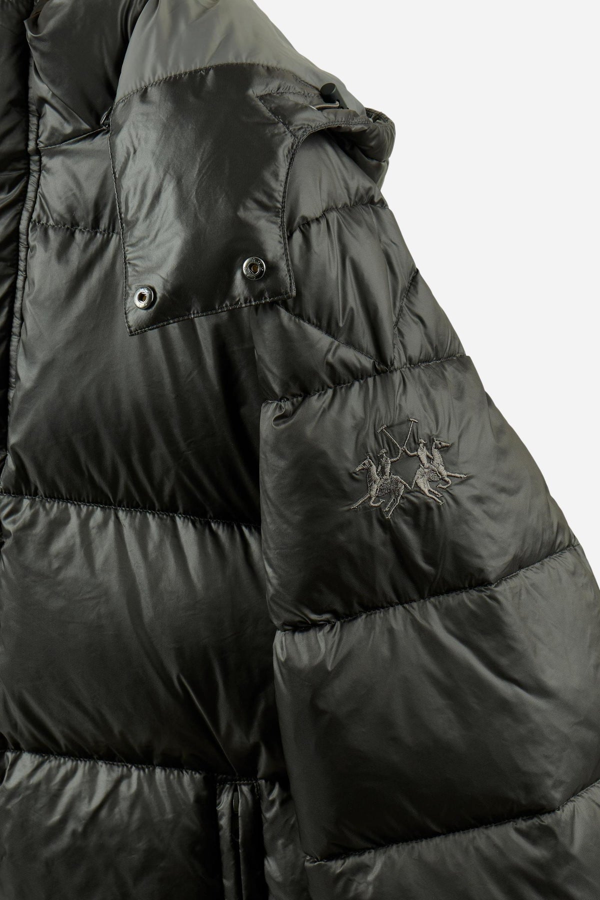 Men's padded feather bomber jacket with detachable hood, iridescent nylon, double zipper, snap buttons, adjustable drawstring, zippered pockets, and embroidered logo. - Black
