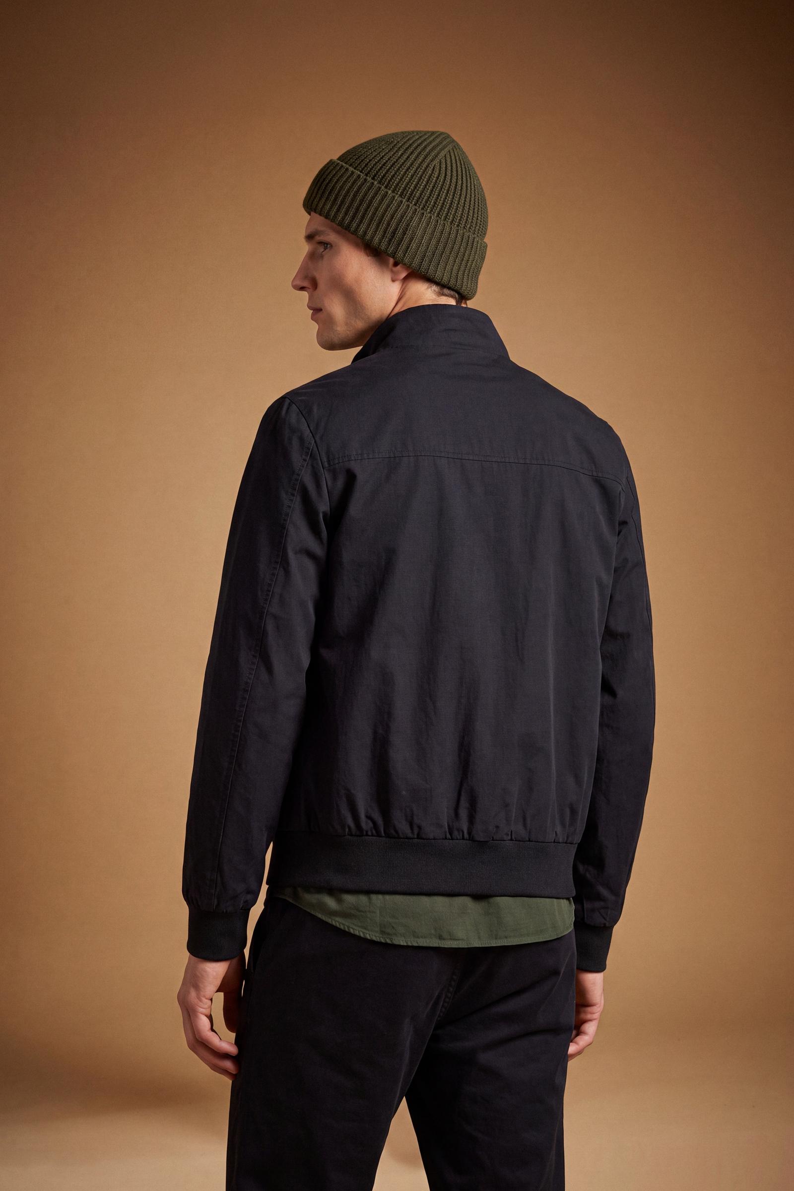 Men's padded jacket in cotton-polyamide blend for comfort and durability. Features high collar, zip closures, elastic ribbed trims, and polyester quilted lining - Black