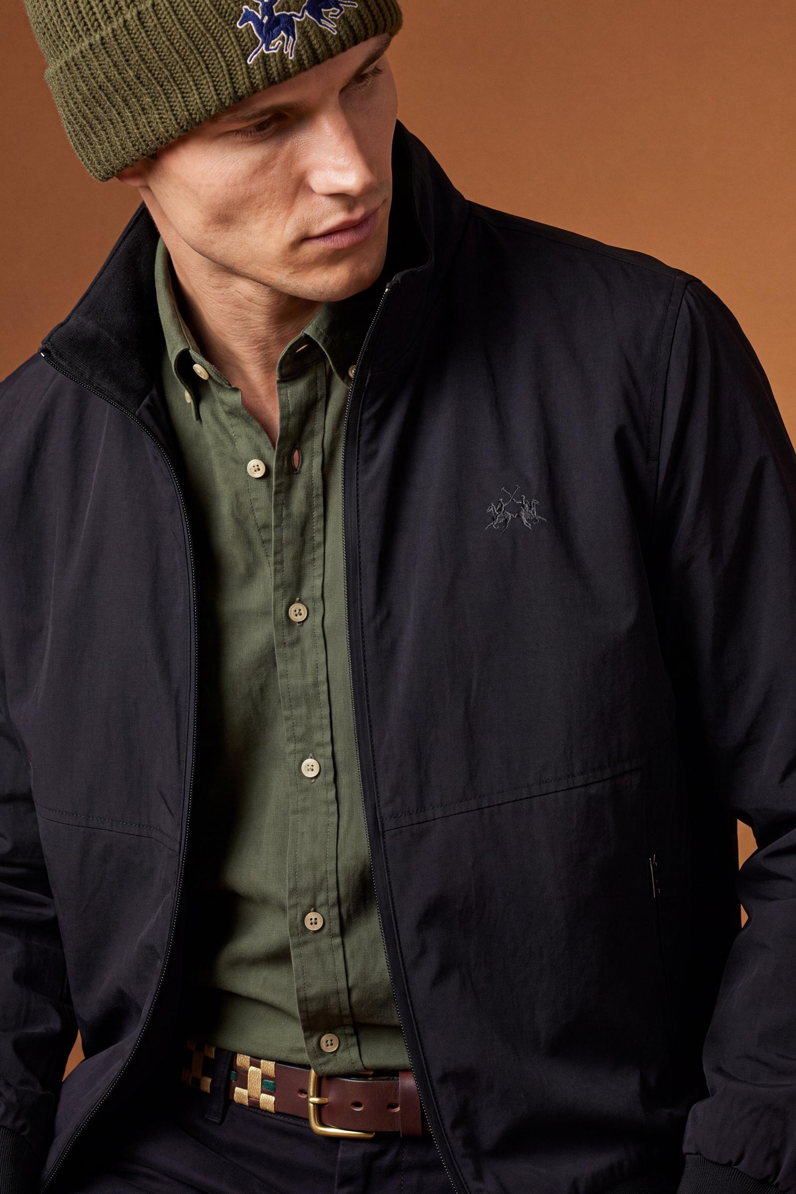 Men's padded jacket in cotton-polyamide blend for comfort and durability. Features high collar, zip closures, elastic ribbed trims, and polyester quilted lining - Black