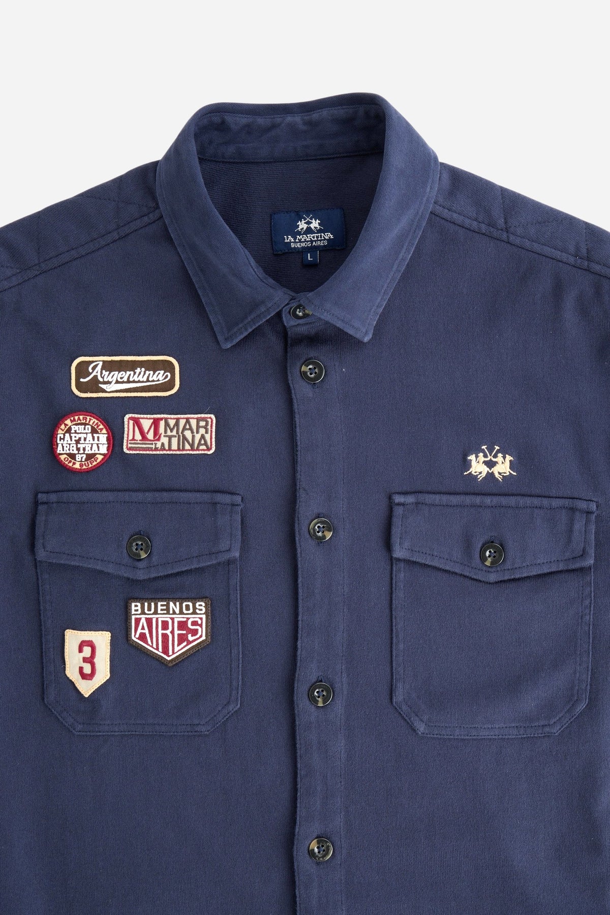 Men's long-sleeve shirt jacket in heavy cotton jersey with diamond quilting, utility flap pockets, embroidered patches, and custom faux horn buttons for a comfortable fit. - Navy Blazer