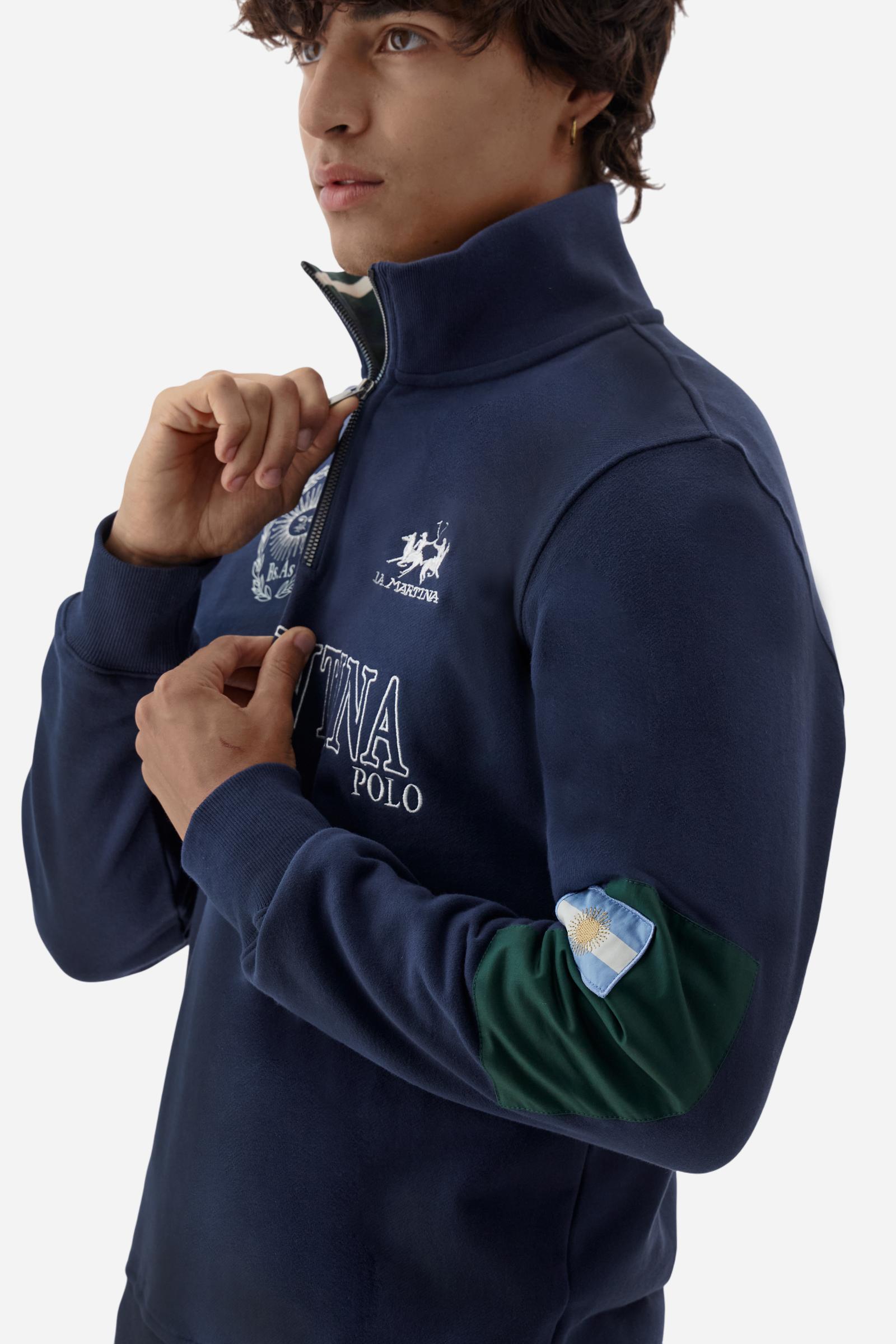Men's long-sleeved solid colour sweatshirt in cotton. Made of pure cotton fabric with a soft, velvety touch. Practical half-zip opening and ribbed cuffs and collar details. Vivid multi-coloured with Argentina-inspired graphics on the chest and sleeves. The logo is embroidered on the left side of chest for a subtle touch of branding. The fit is regular to suit everyday wear. The model is wearing a size L. - Navy