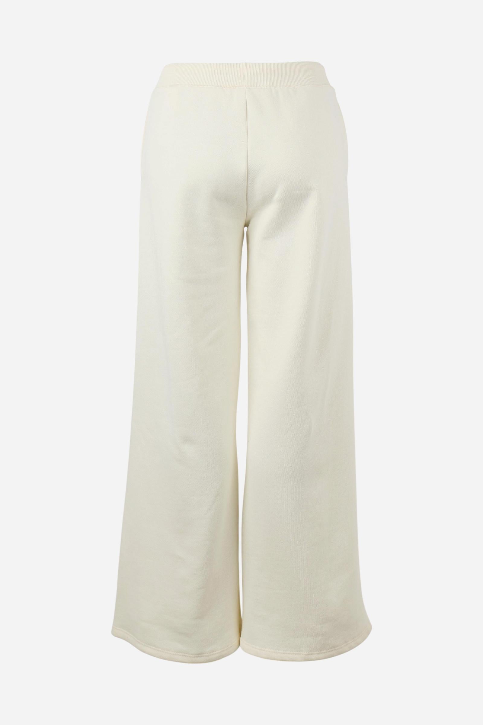 Women's pants in soft brushed cotton with an elastic waistband, adjustable drawstring, vertical side pockets, and a relaxed wide-leg fit for all-day comfort. - Pristine