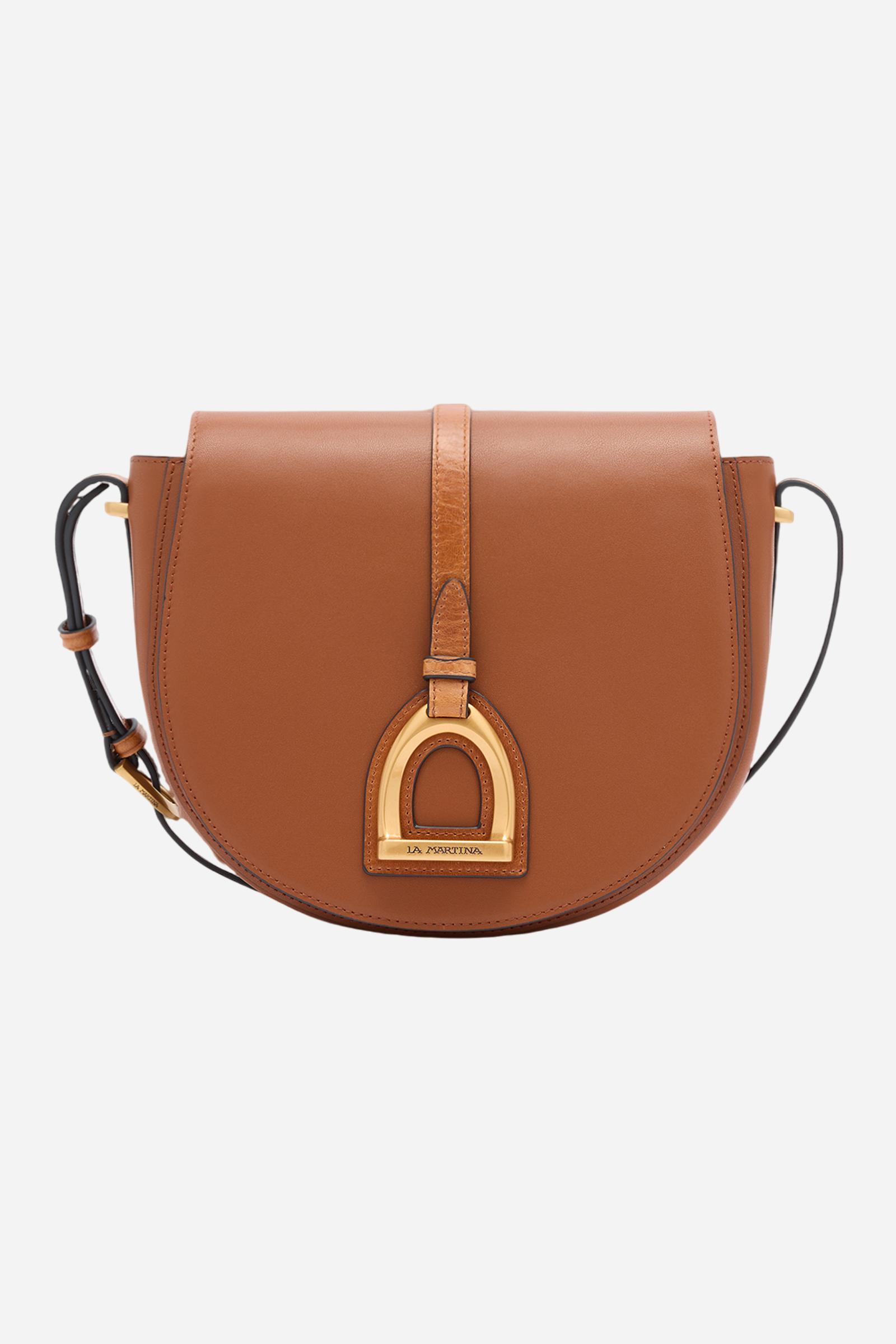 Crossbody bag in calfskin leather with leather details, structured and sophisticated. With large front flap closed by hidden magnet, golden logo buckle, leather inserts, and adjustable strap that evoke equestrian style. Dimensions:19 x 16 x 6 - COGNAC/LEATHER
