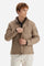 Men’s quilted nylon husky jacket with high collar. Front closure with customized zip and large faux-leather buttons. Interior lined with striped bicolor polyester. Contrast details on the inside (pockets, profiles, back-neck tab). Clean design with chest pocket closed by zip and vertical side pockets. Adjustable back straps with metal snap buttons. Logo patches on the sleeves and multicolor embroidered lettering on the outer collar. Part of the Guards capsule. Regular fit. Model wears size L. - Moon Rock