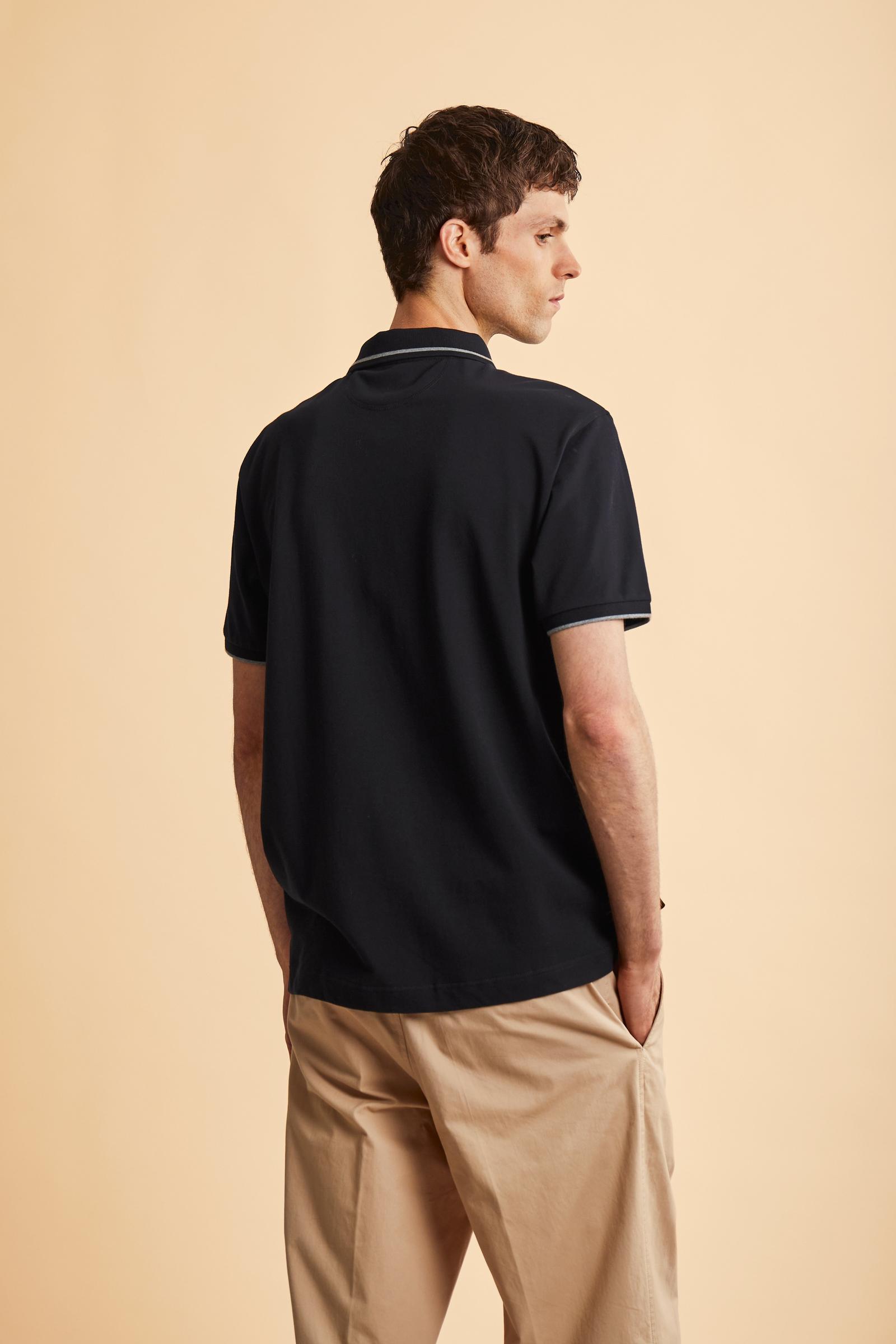 Men's short-sleeve polo in stretch piqué fabric with ribbed details, embroidered logo, bold lettering, and a relaxed regular fit for versatile comfort. - Black