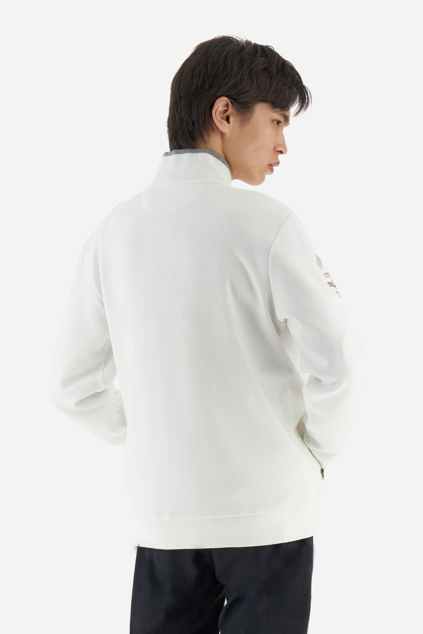 Men's long-sleeved, full-zip solid colour sweatshirt. Made of stretch cotton-blend piqué. Design with front opening fastened by a zip, high collar in two-tone ribbing. Solid colour ribbed cuffs and waistband. The small brand logo and Guards crest are embroidered in multi-coloured thread on the chest. On the right sleeve, there is another embroidery of a crest inspired by the British royal household. The regular fit silhouette is practical for everyday wear. The model is wearing a size L. - Off White