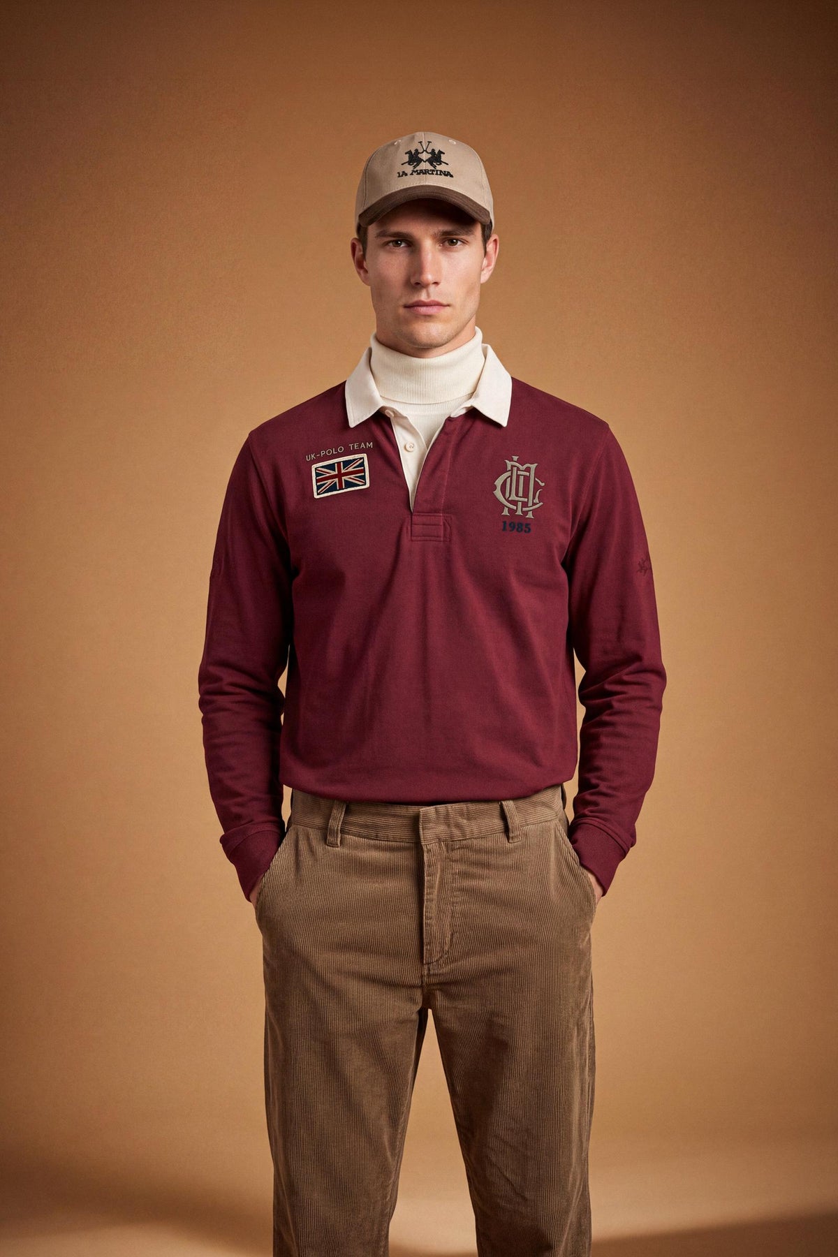 Men’s long-sleeve polo in heavy pure cotton jersey with textured fabric, hidden placket, ribbed cuffs, and heritage British polo graphic for a classic, clean fit. - Red Dahlia