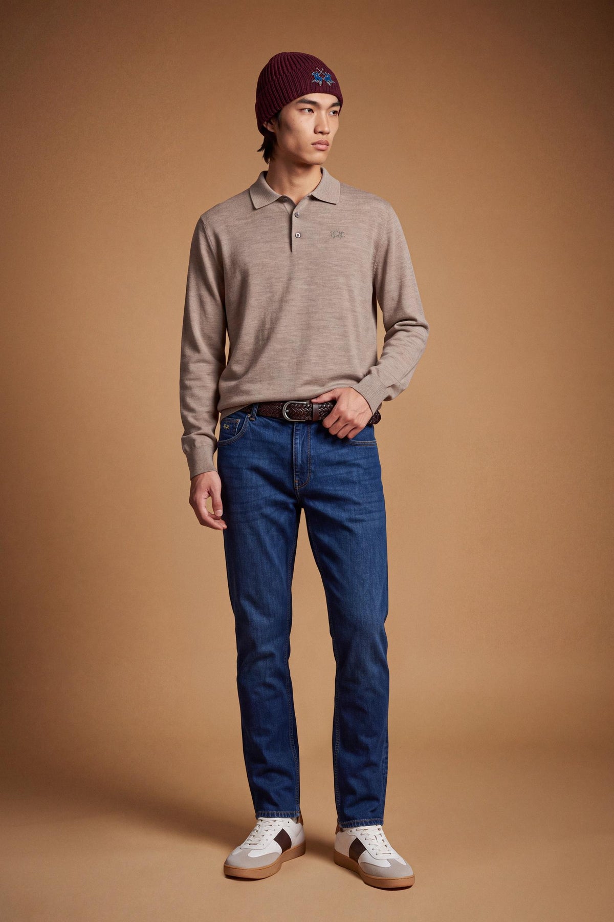 Men's long-sleeve polo made from 100% merino wool offers a comfortable fit, classic knitted collar, ribbed cuffs, and a subtle embroidered logo on the chest. - Vintage Khaki