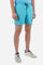 Plain men's swimming shorts made of nylon. Elastic waistband with a personalised drawstring for waist adjustment. On the inside of the shorts is an elasticated mesh brief. Double side pocket on the hips and patch pocket with flap on the back, on the right side only. The large logo is embroidered in a contrasting colour thread on the bottom of the left leg on the front. Regular fit. The model is wearing a size L. - Blue Atoll