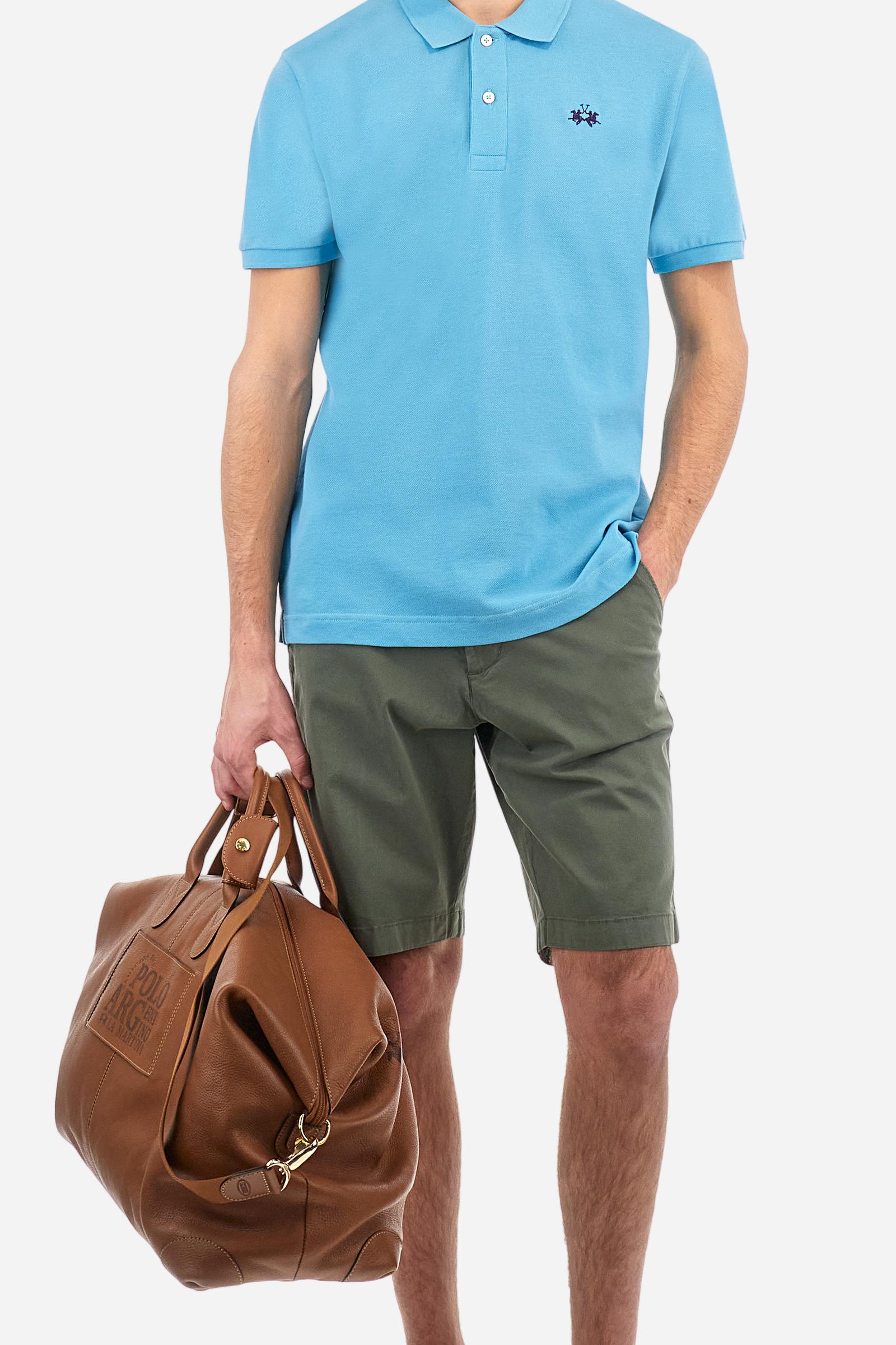 Men's plain-coloured, short-sleeved, regular-fit cotton polo shirt. Contrasting La Martina logo sewn onto the chest. This versatile garment goes perfectly with a pair of jeans from the collection. - Blue Mist