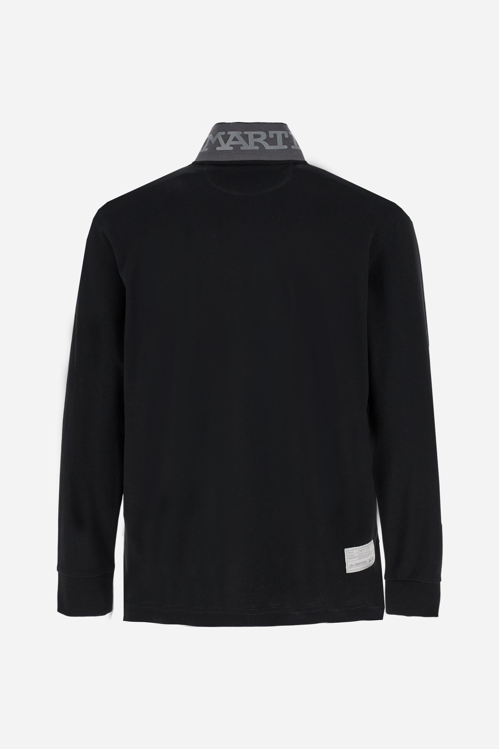 Men's long-sleeved solid colour polo shirt. Made of high-quality stretch Piqué. The collar and cuffs are in solid colour ribbing. The undercollar features a print of the iconic La Martina lettering in a contrasting colour. Featuring a logo embroidered on the chest in a contrasting colour. On the back at the bottom, the guarantee label typical of the brand's iconic models is applied. Regular fit. The model is wearing a size L. - Black