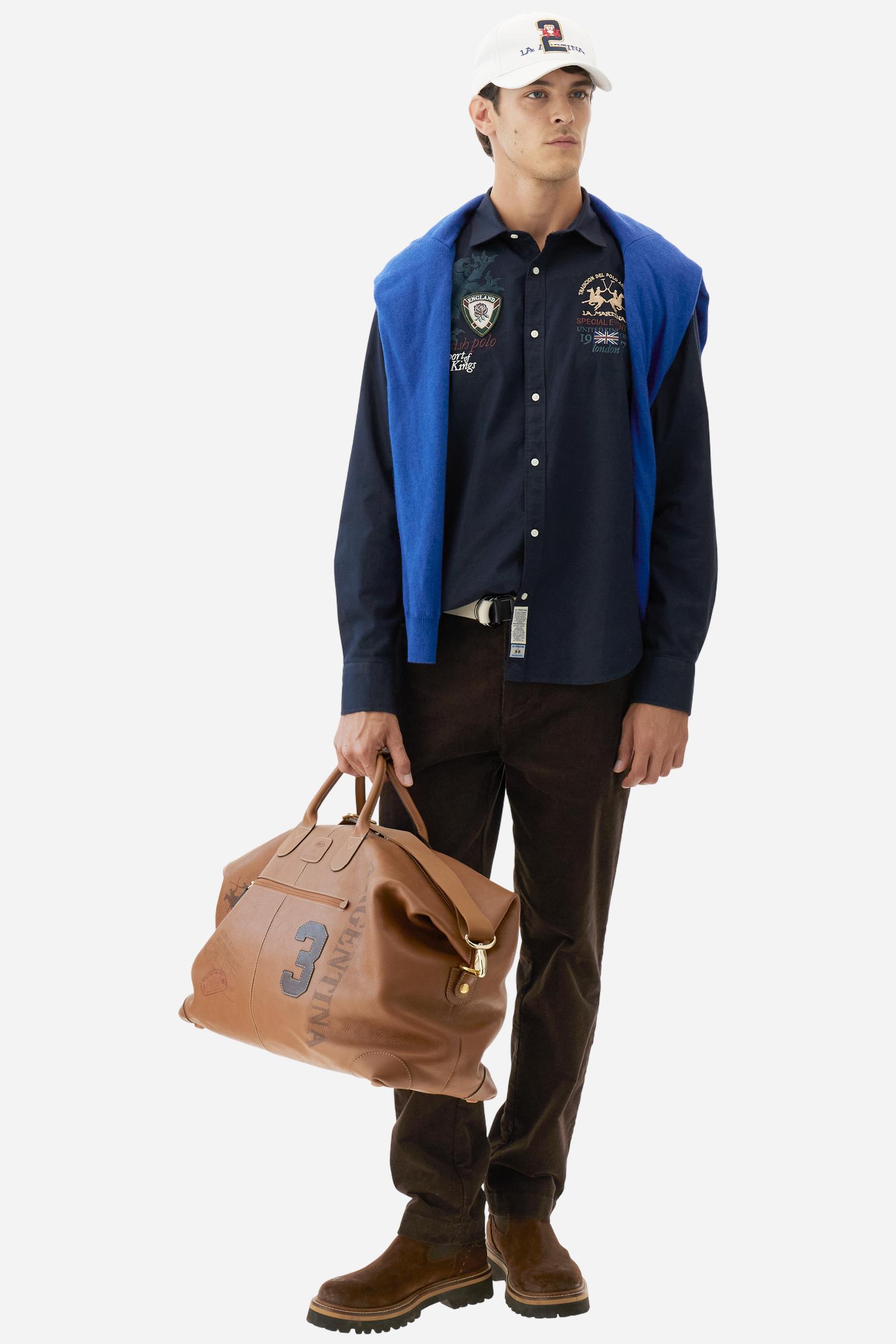 Classic men's long-sleeved shirt in stretch cotton Oxford, solid colour. Finished with a French collar and interior regimental-pattern fabric details. Chest features multicolour prints and embroideries inspired by British Polo, including the large team logo embroidered in contrast. Regular fit ensuring comfort and enhancing any physique. Model wears size L. - Navy