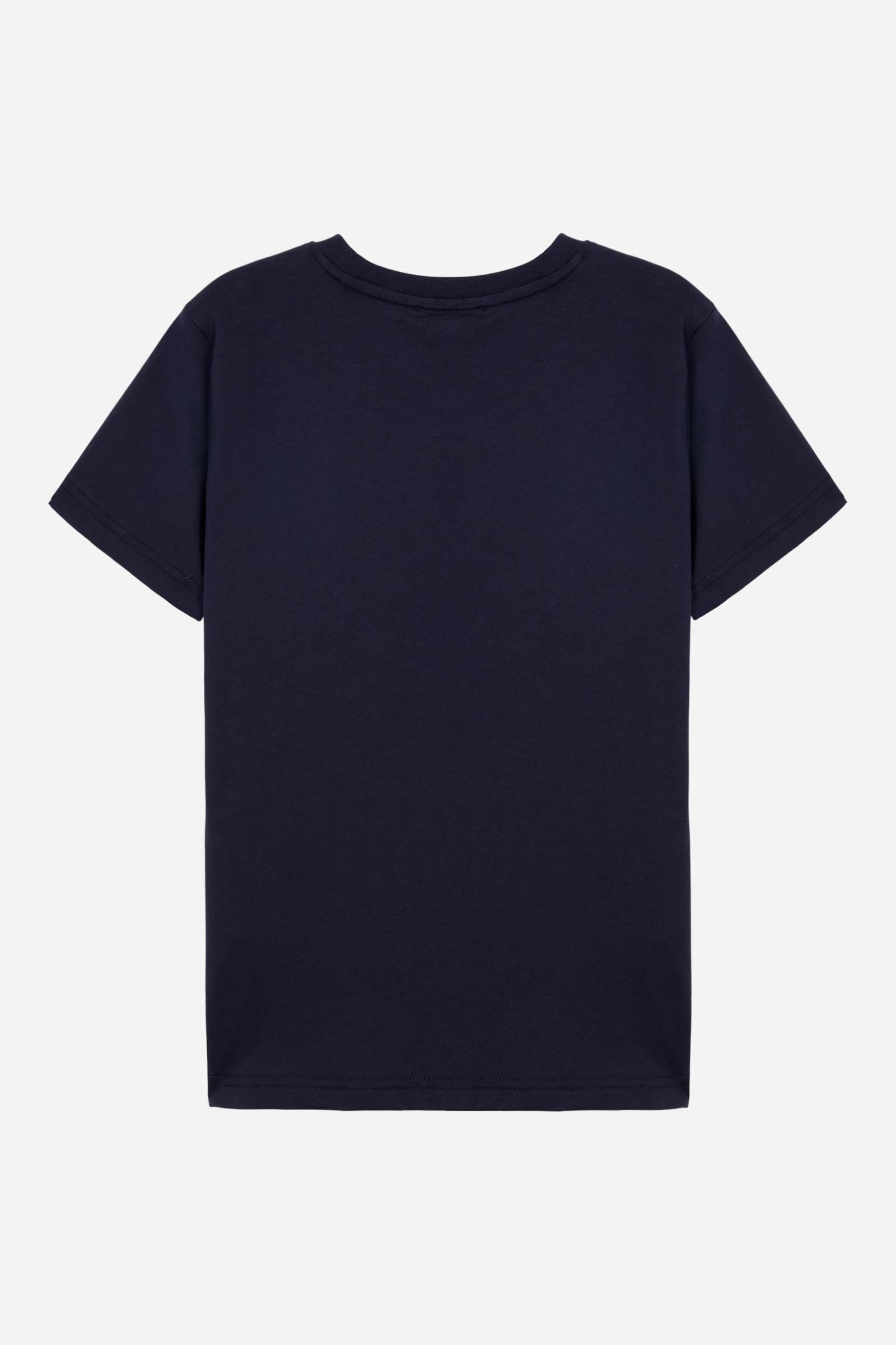 Short-sleeved T-shirt for boys made from soft 100% cotton jersey in a solid colour. The style features a regular fit and tonal ribbed crew neck. The maxi front print, featuring the iconic crossed polo players logo and La Martina lettering, gives the garment strong visual impact and a bold sporty style. - Navy