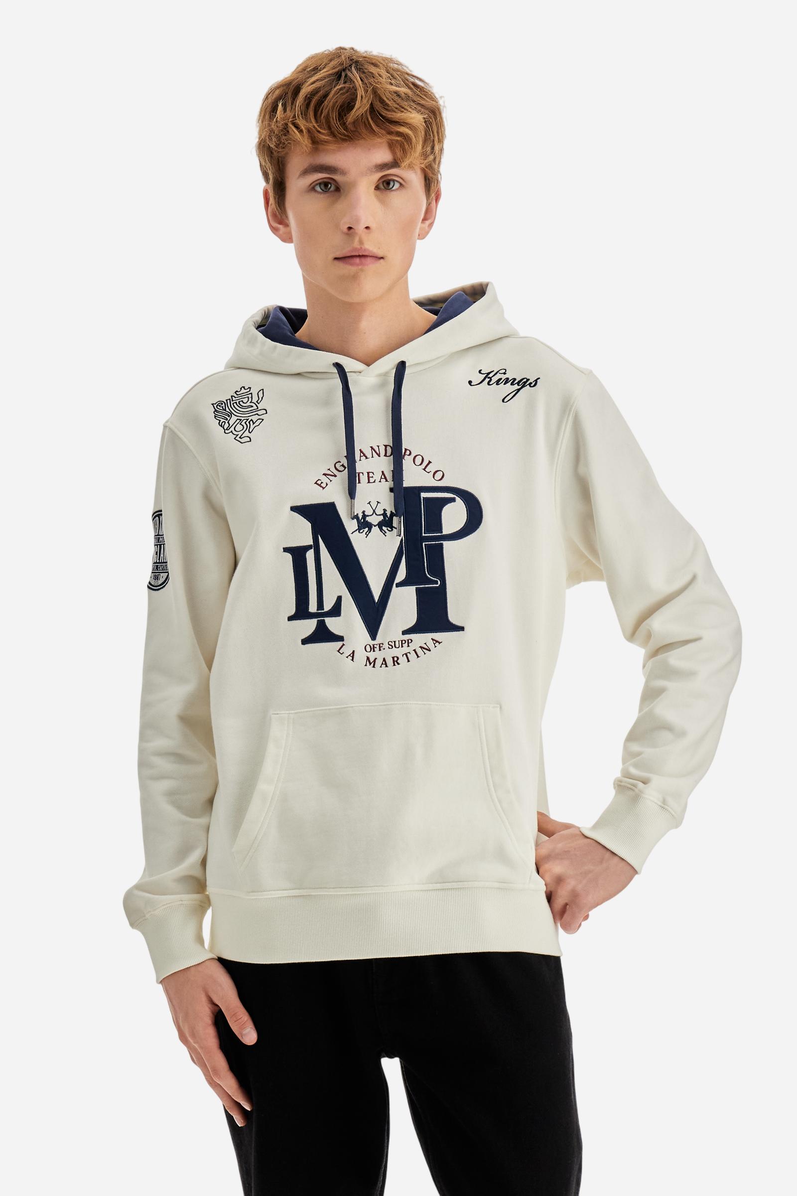 Men's long-sleeved hoodie in solid cotton French terry. Features a large kangaroo pocket, hem and cuffs in tone-on-tone rib. Adjustable hood with contrast lining. Chest and sleeves decorated with modern LM monogram graphics inspired by British polo. Contrasting embroidered logo on the chest. Regular fit for a relaxed and comfortable silhouette. Model wears size L. - Off White