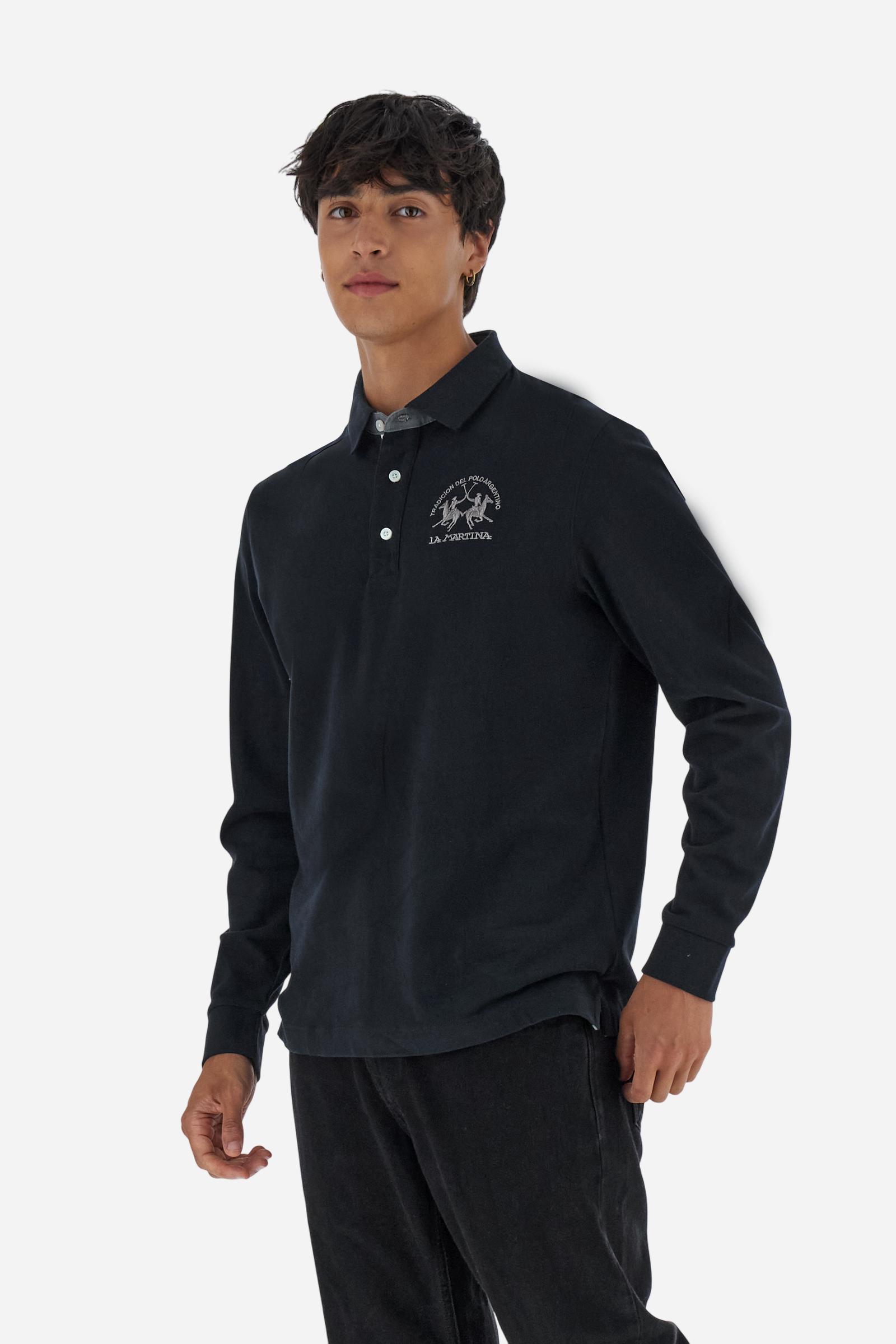 Classic men’s long-sleeve polo in soft-touch 100% cotton jersey. Contrast gabardine collar, three-button placket with multicolor striped tape. Iconic La Martina lettering printed in contrast under the collar. Small contrast logo embroidered on the chest. Regular fit for a balanced silhouette. Model wears size L. - Black