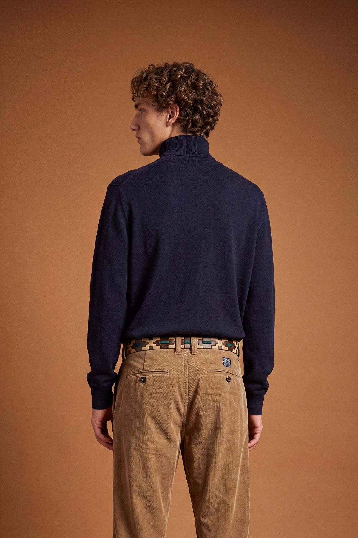 Men's long-sleeve sweater with a high-neck, soft wool-cotton blend, ribbed collar and cuffs, and subtle tone-on-tone embroidered logo for a comfortable, classic fit. - Navy